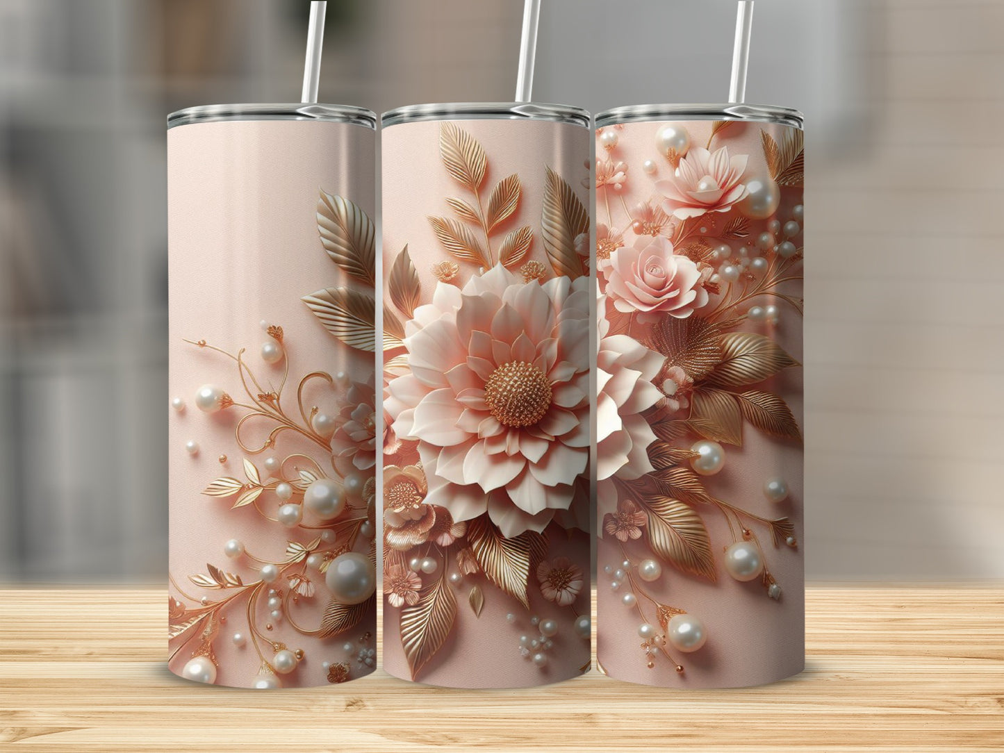 Pink floral and pearl patterned tumbler with straw on wooden surface.