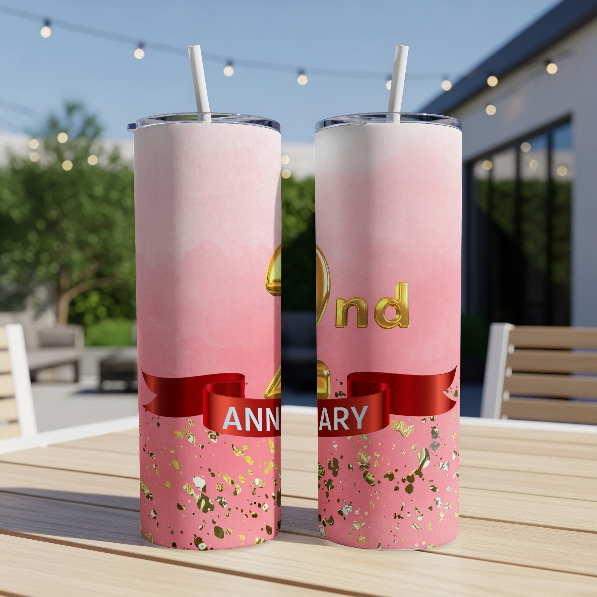 Pink tumbler with "2nd Anniversary" text, confetti, and a red ribbon.