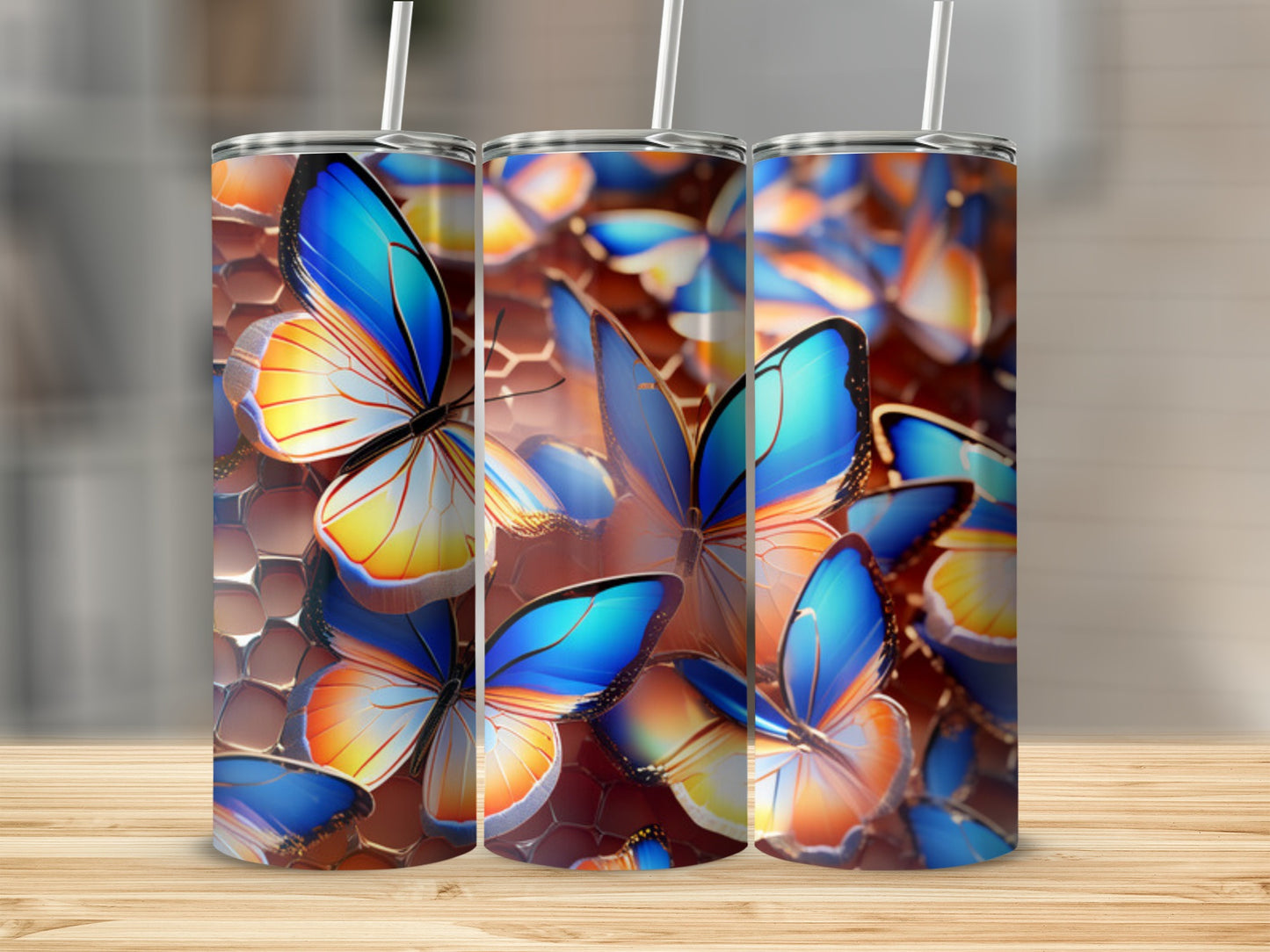 Three tumblers with a close-up, colorful butterfly pattern.