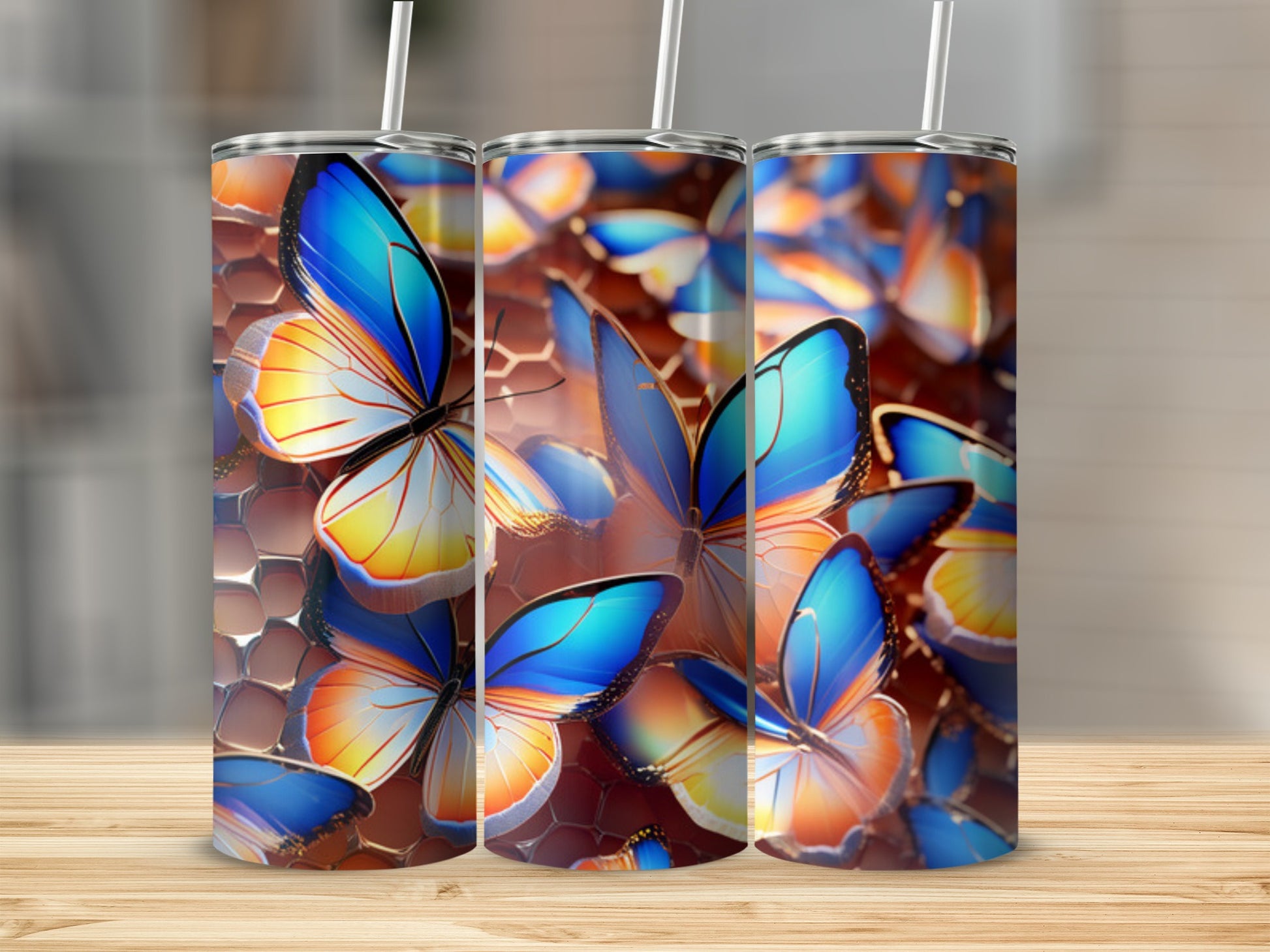 Three tumblers with a close-up, colorful butterfly pattern.