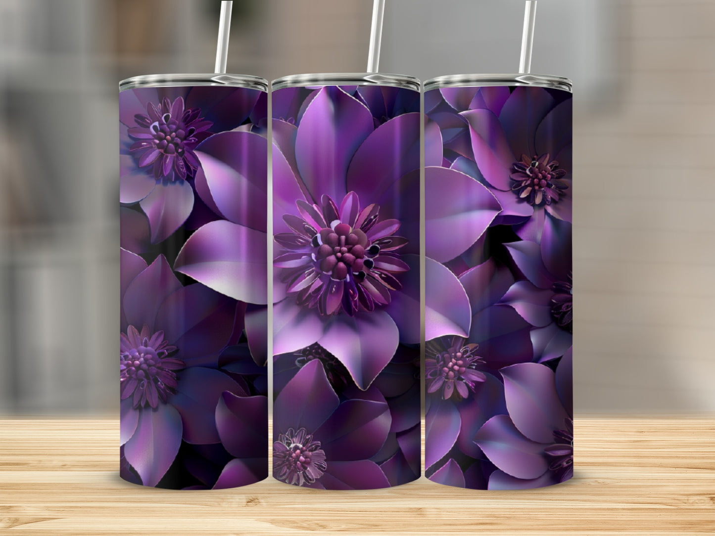 Three tumblers with a deep purple floral pattern on a wooden surface.