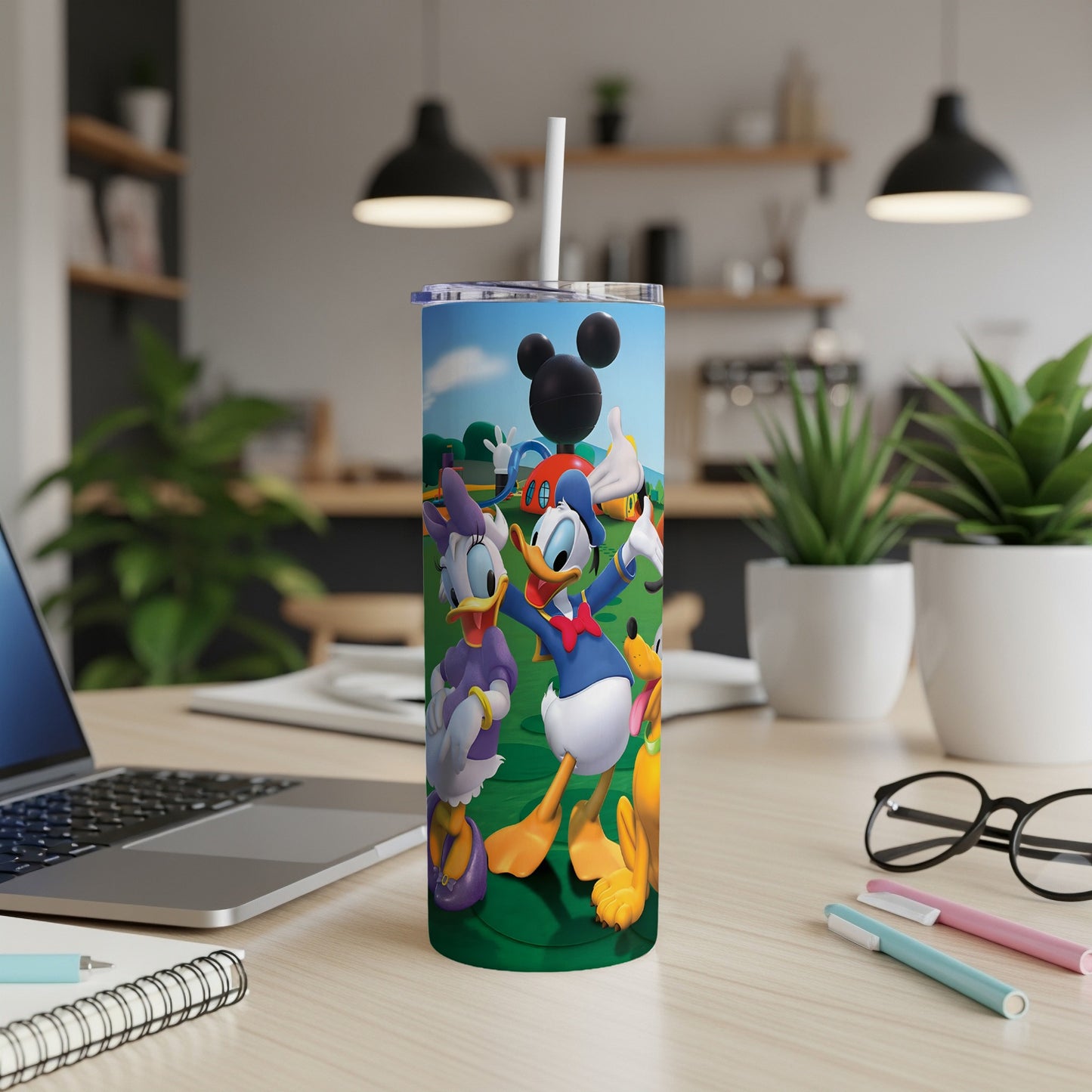 Mickey Mouse, Donald Duck, Daisy Duck, and Pluto characters on a blue tumbler.