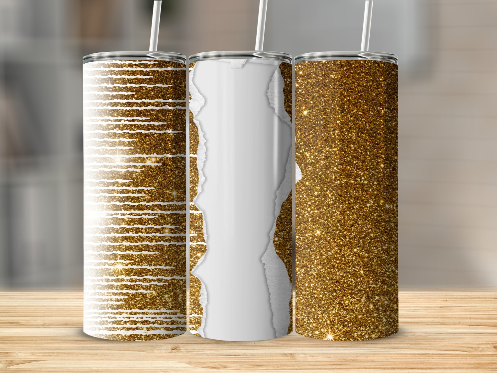 Three glitter tumblers with unique designs on a wooden surface.