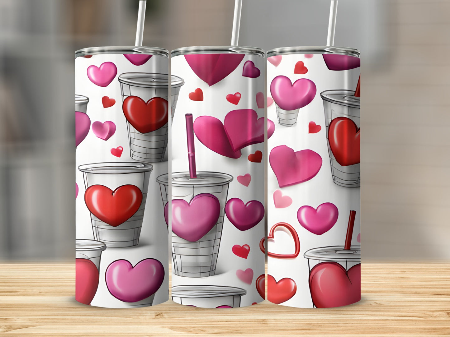 Three tumblers with a repeating pattern of red and pink hearts and cups.