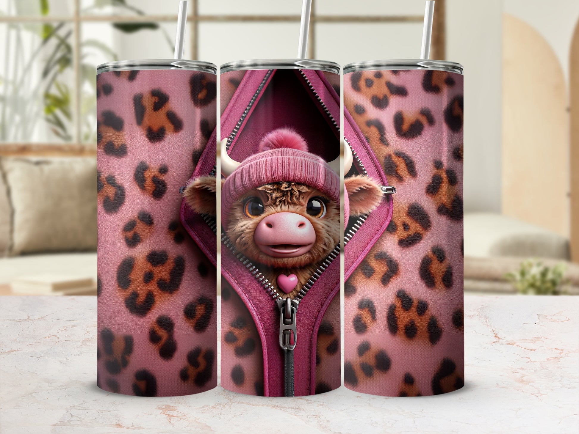 Pink leopard print tumbler with a zippered opening revealing a cow wearing a beanie.