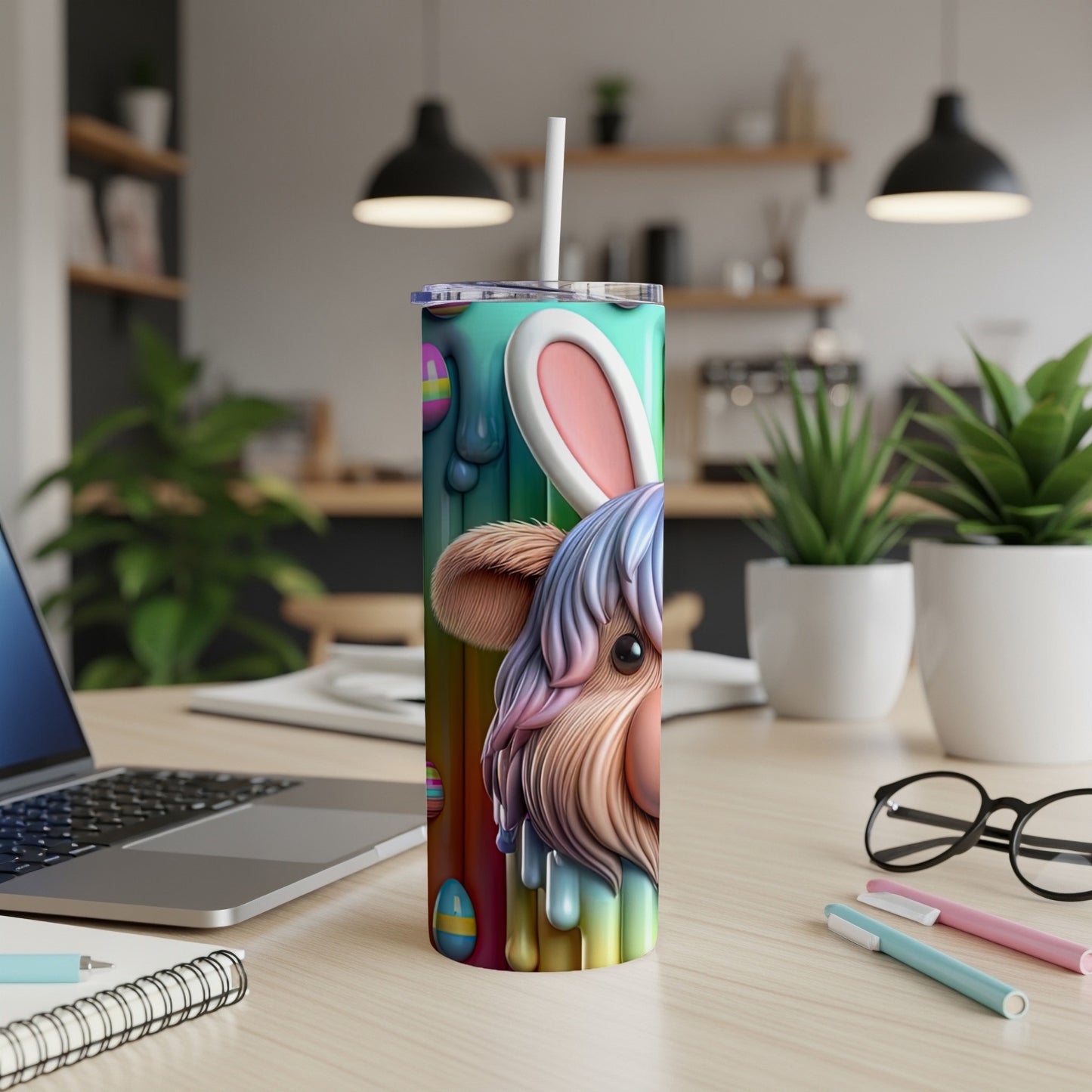 Easter tumbler with bunny ears and dripping pastel egg design.