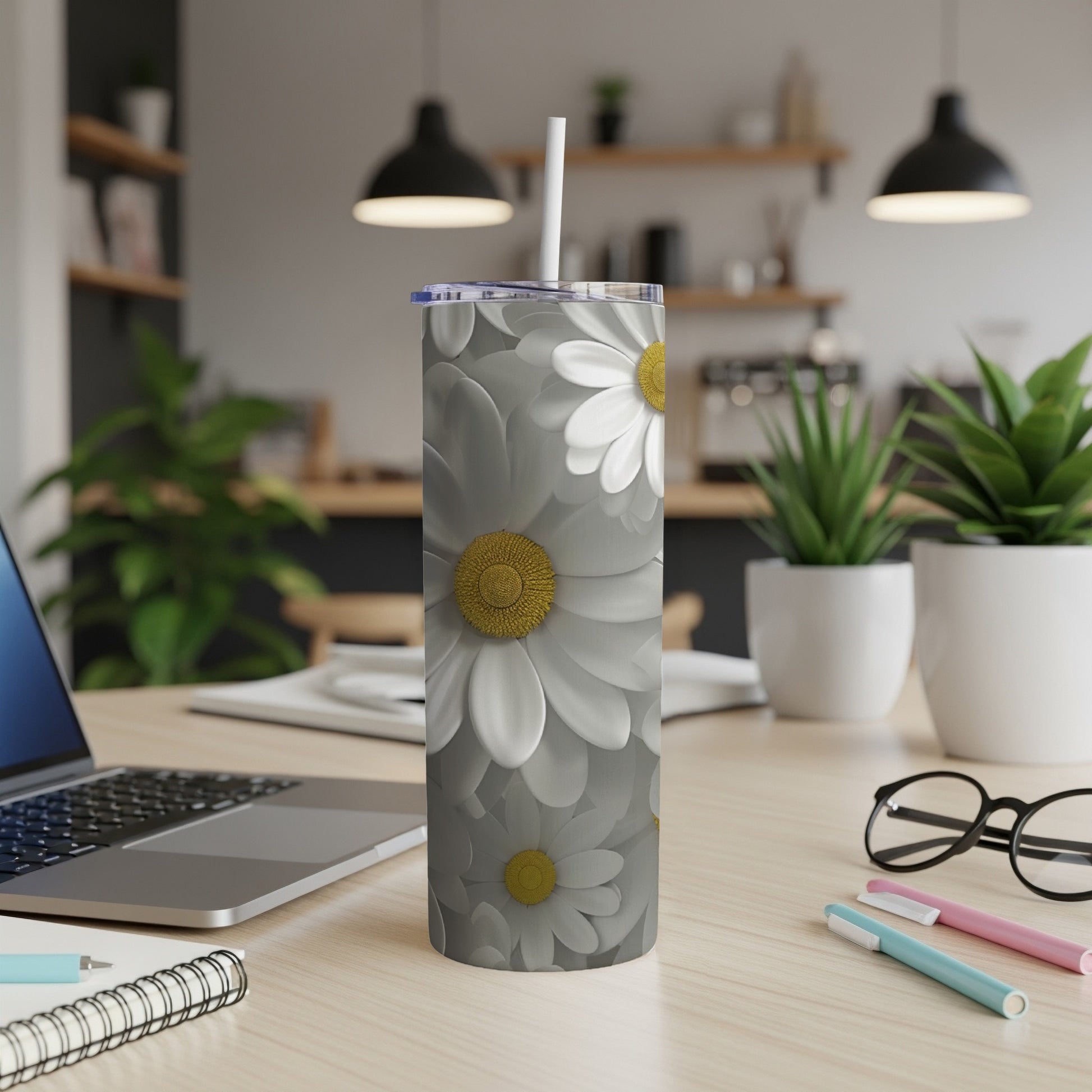 Gray tumbler with a repeating pattern of white and yellow daisies.