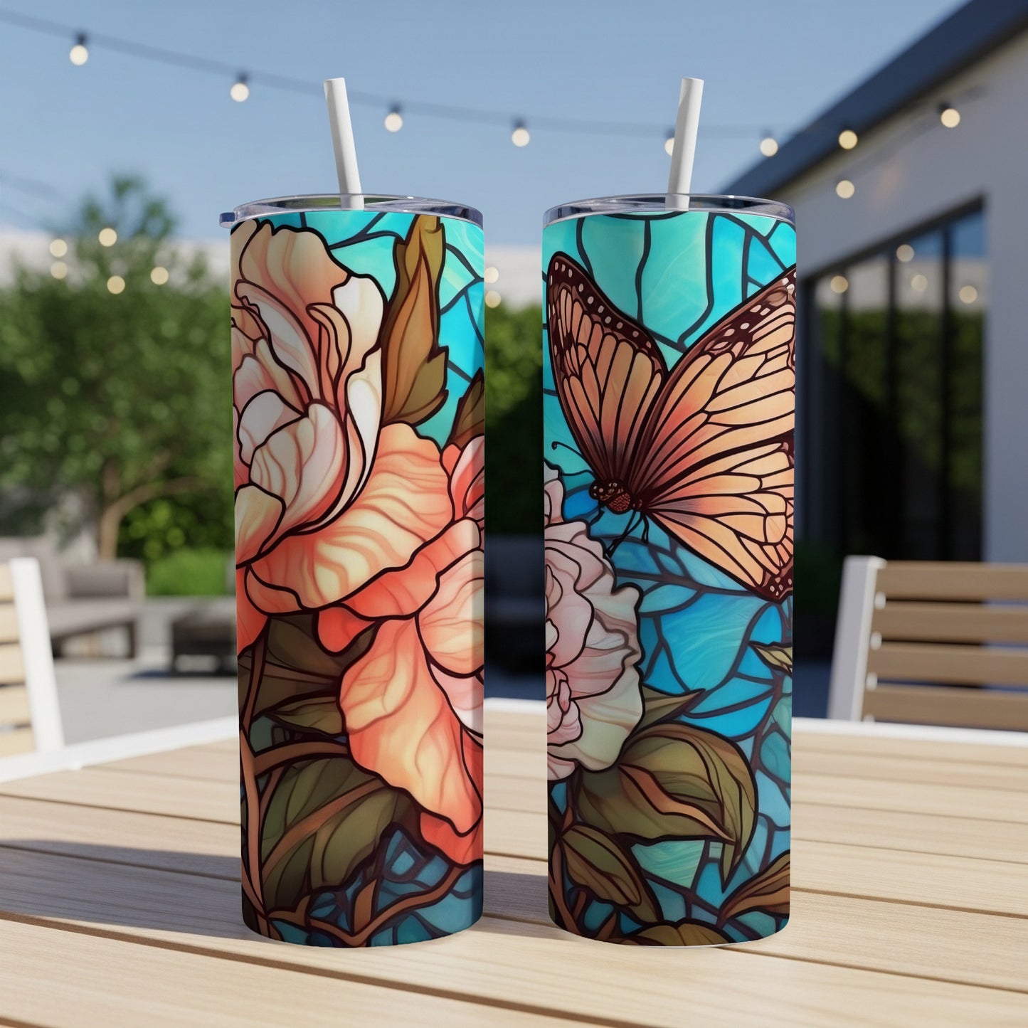 Two tumblers with stained glass floral and butterfly designs.