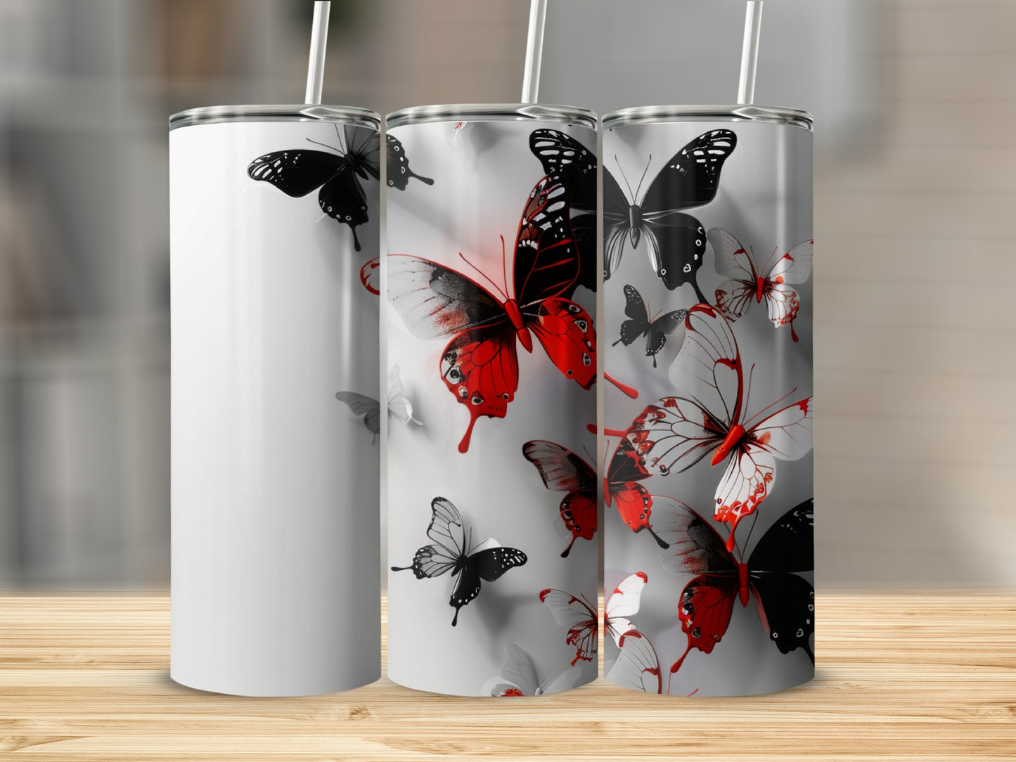 White tumbler with red and black butterflies and white butterflies.