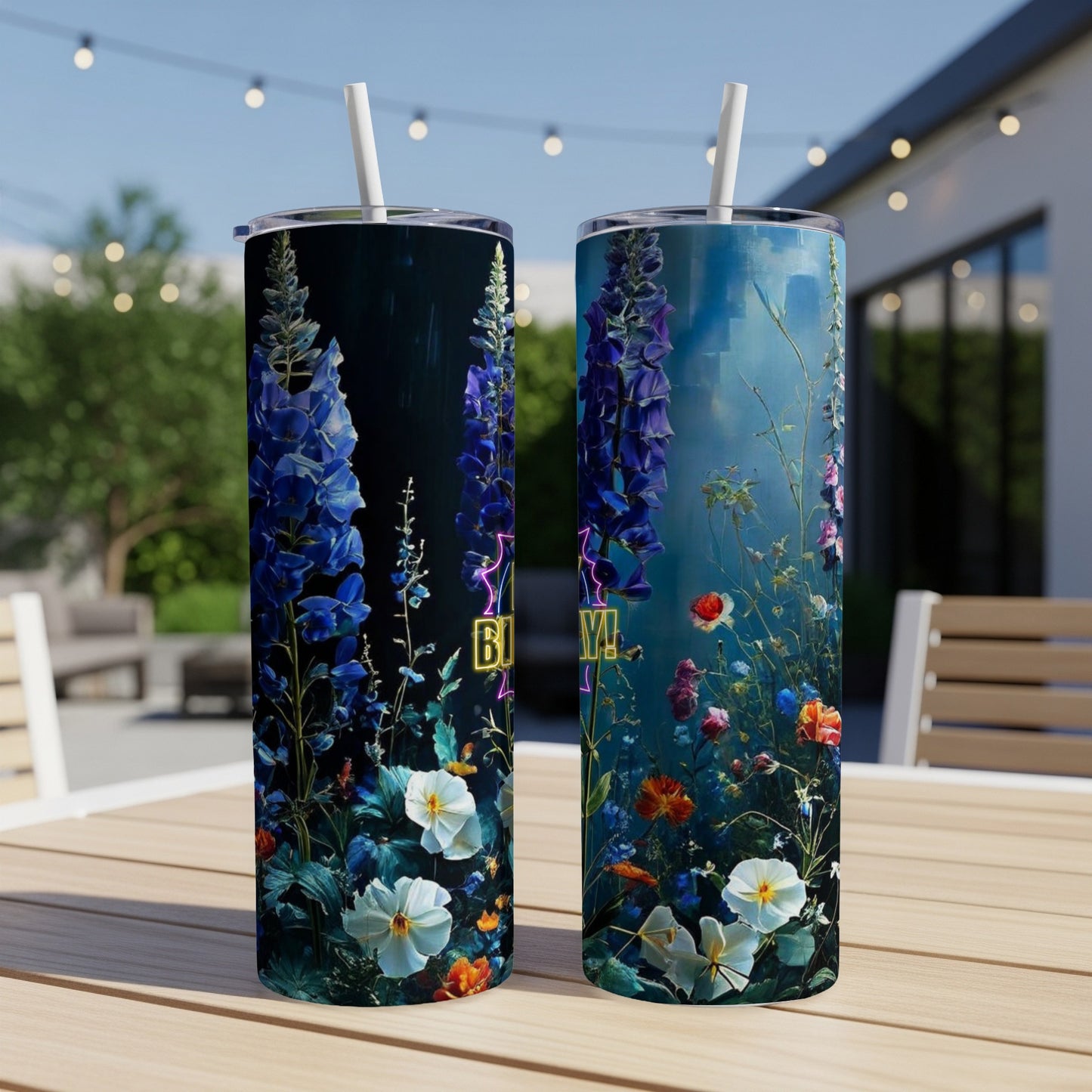 Two tumblers with blue, pink, and white floral designs and straw.
