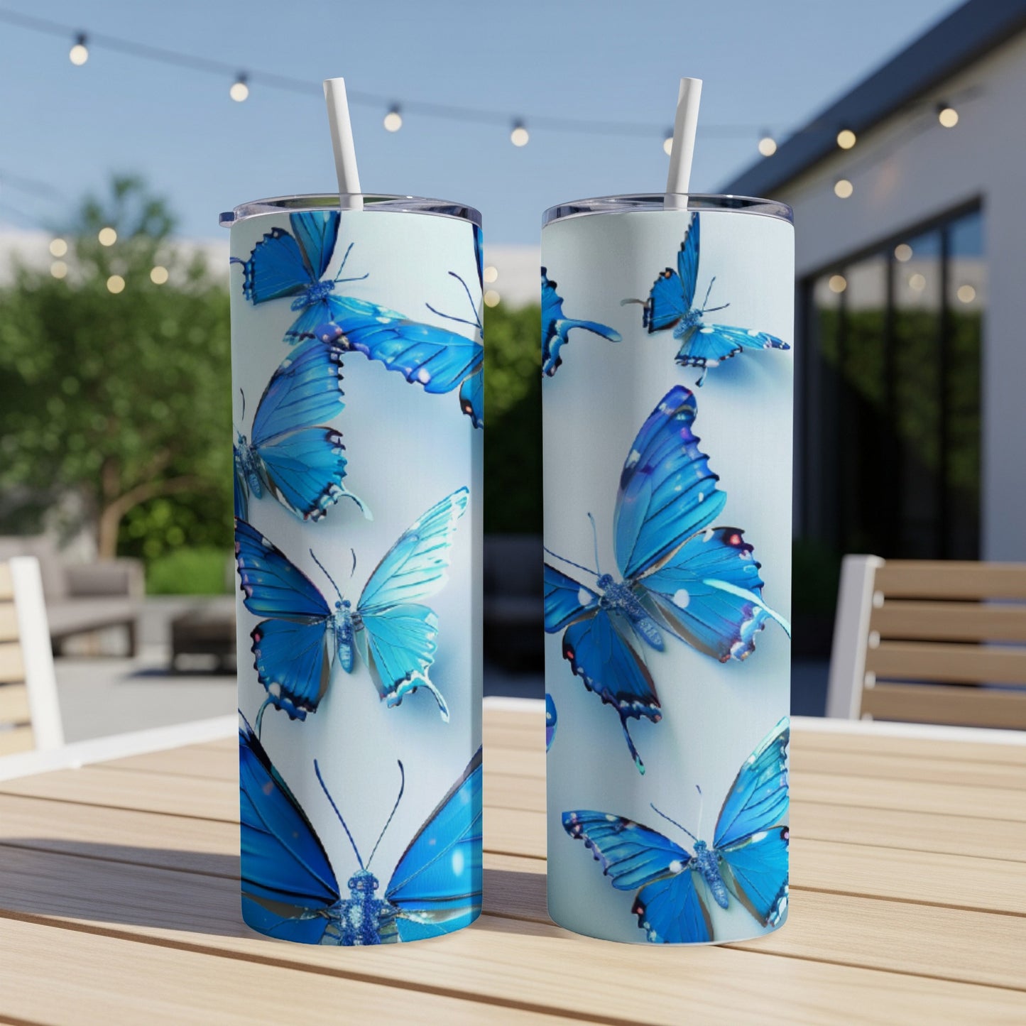 Two tall tumblers with a blue butterfly pattern.