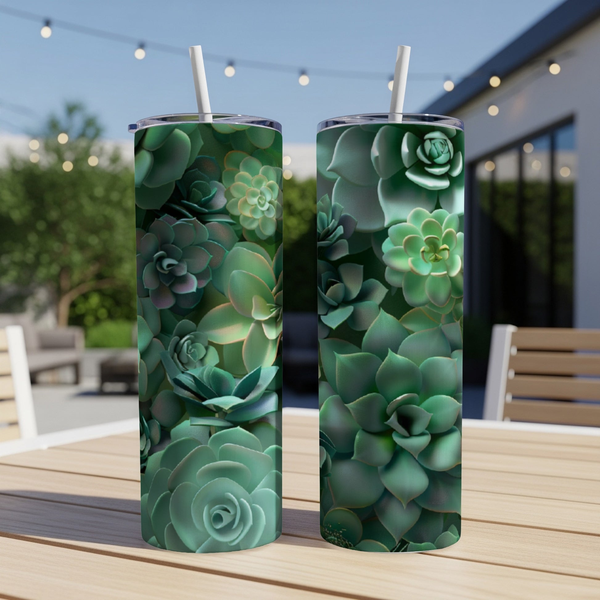 Two tumblers covered in a pattern of green succulents, with straws.