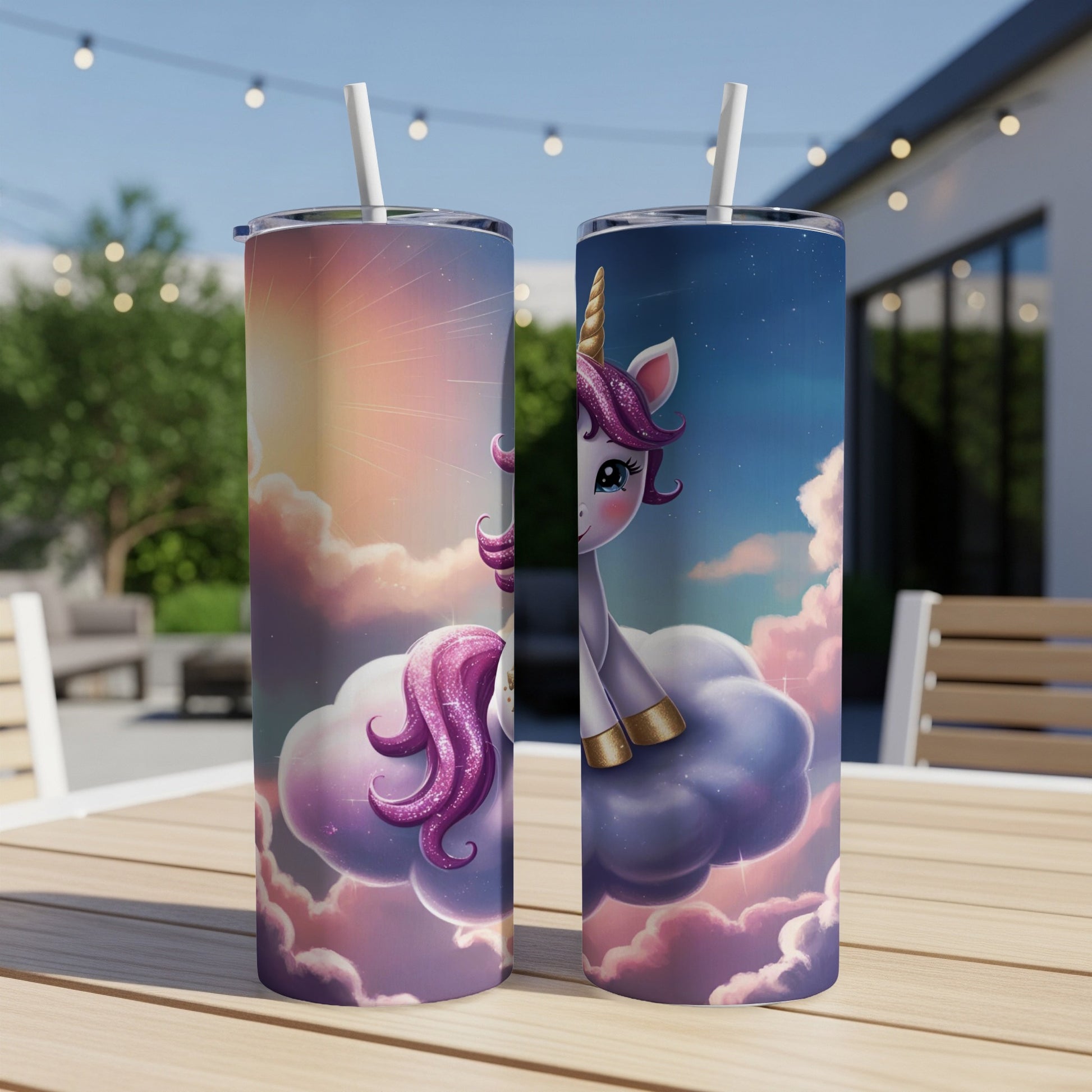 Two tumblers with a purple unicorn on clouds, set on a table outdoors.