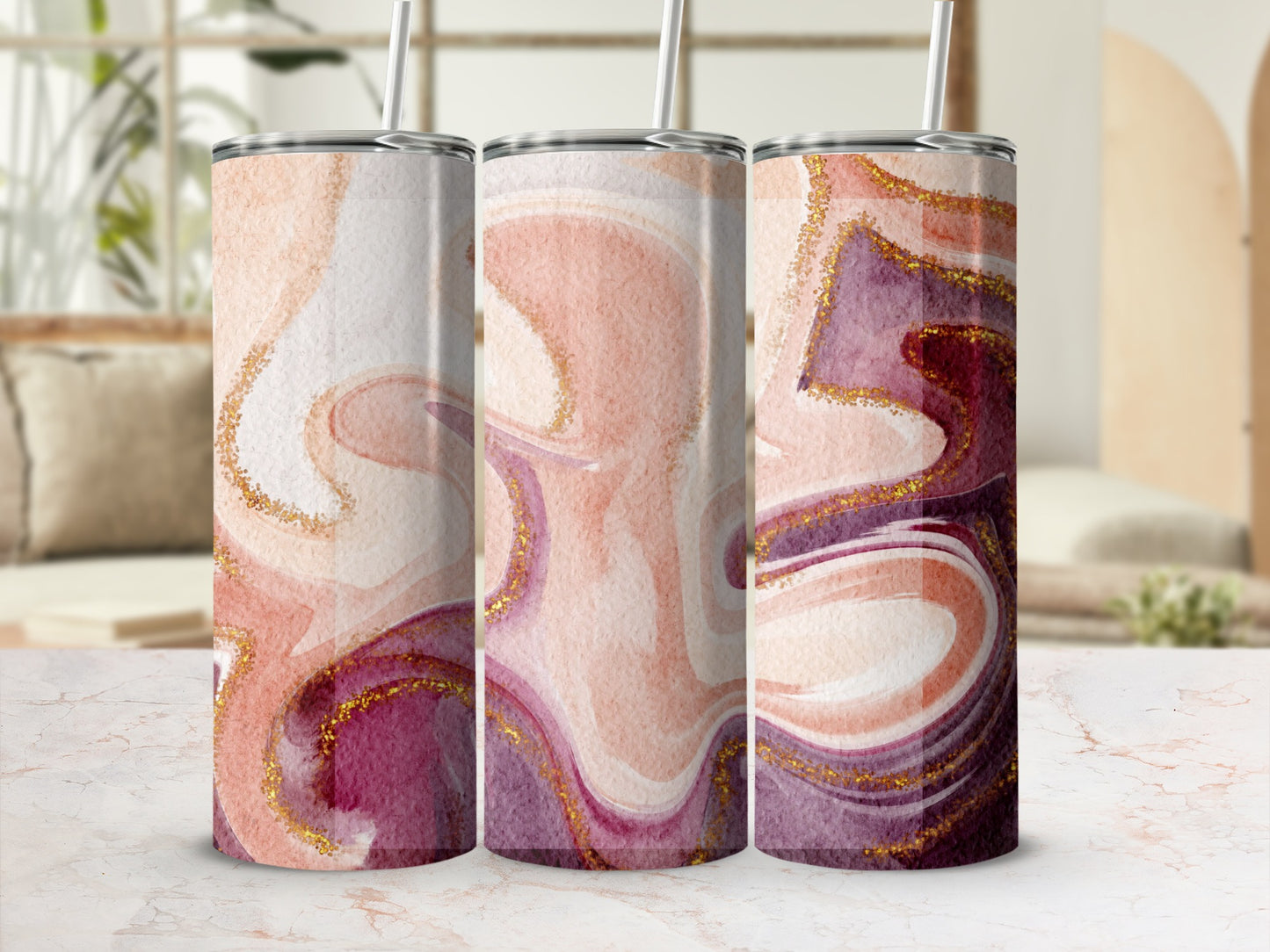 Three tumblers with marbled pink, gold, and purple patterns.