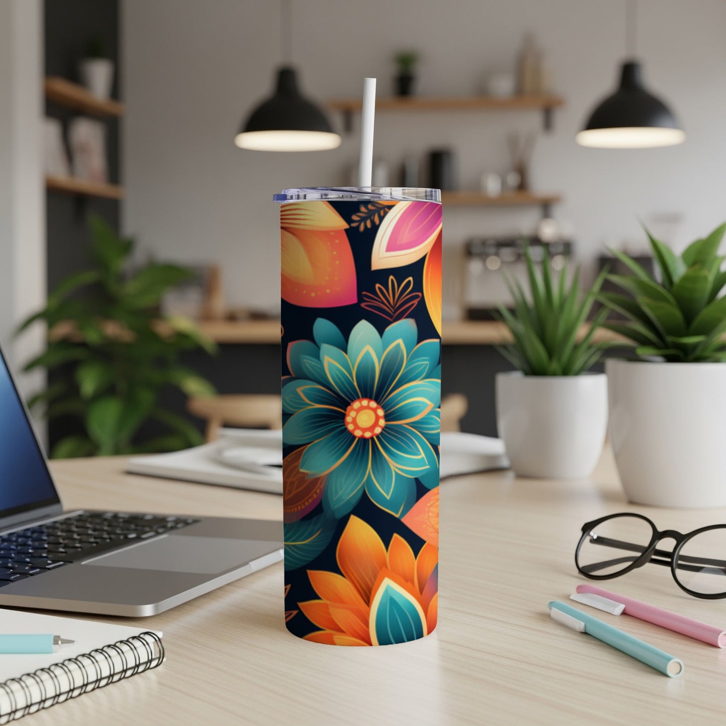 Tall tumbler with colorful floral design on dark background.