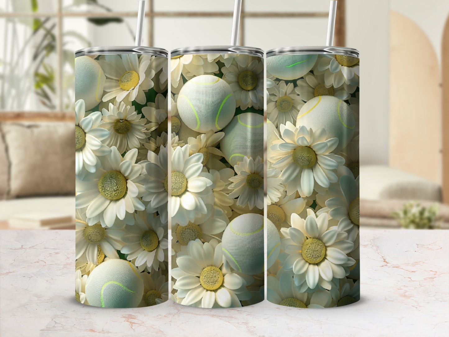 Trio of tumblers with a floral and tennis ball pattern.