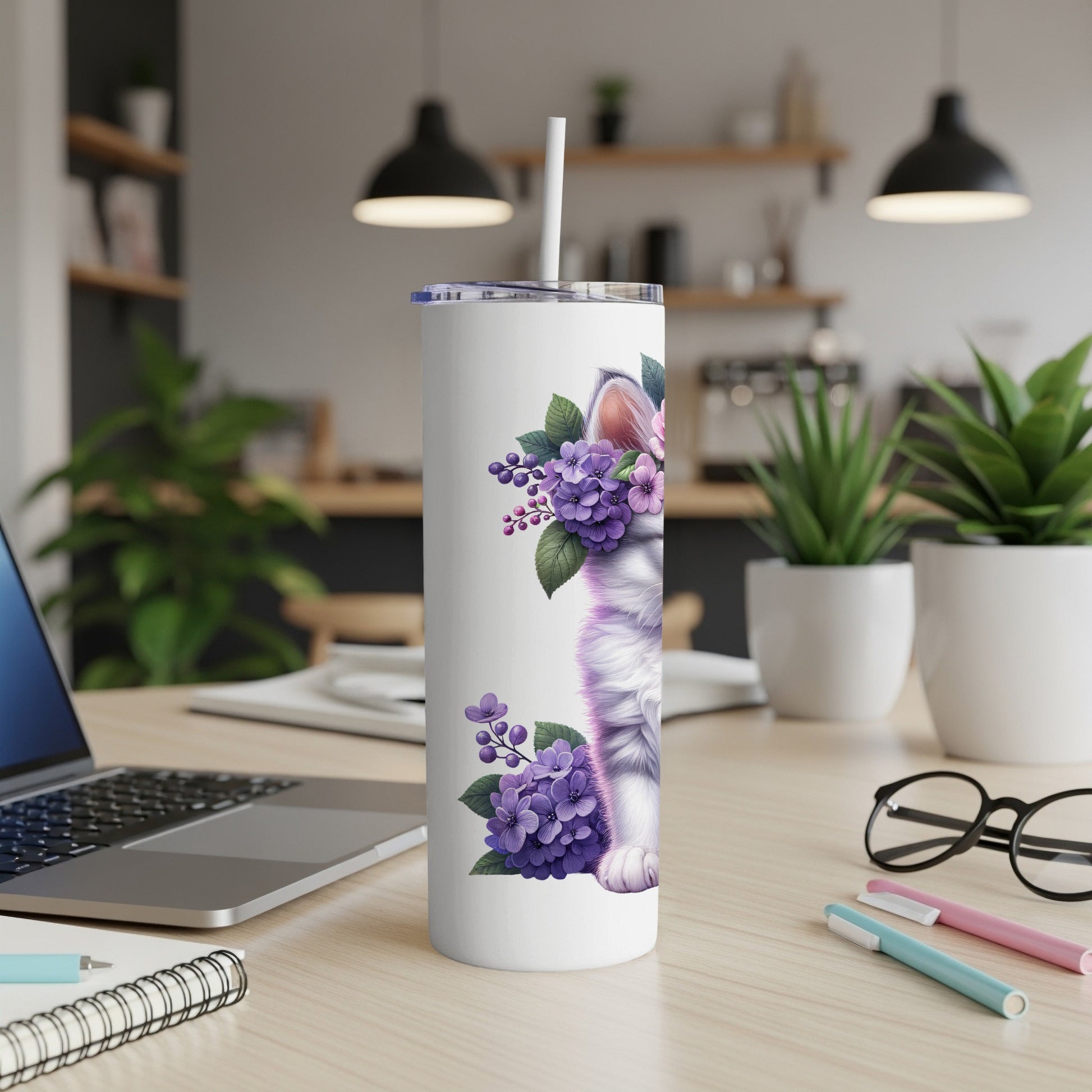 White tumbler with white cat and purple flowers design.