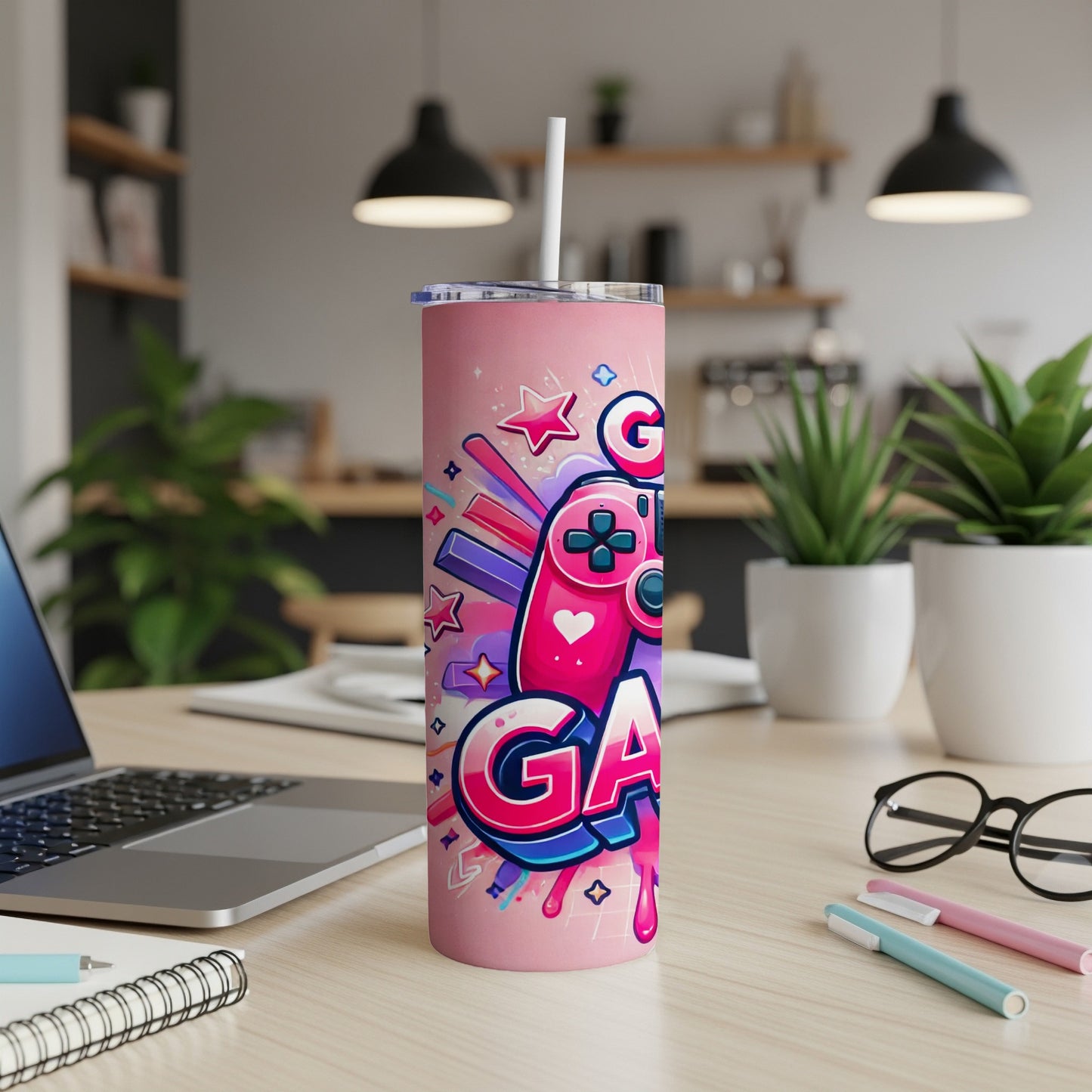 Pink tumbler with "GAME" text, joystick, and stars design.
