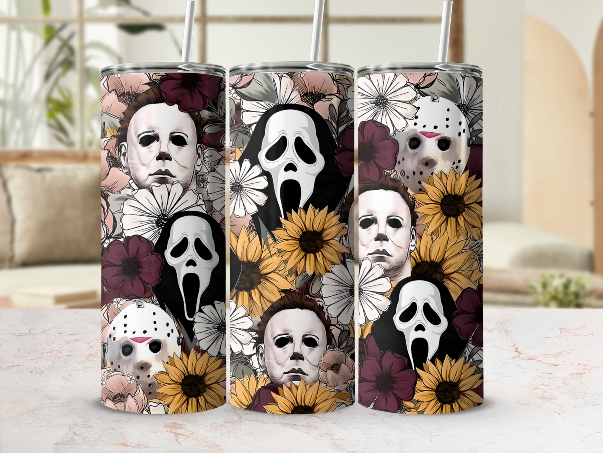Three tumblers featuring horror characters and floral patterns.