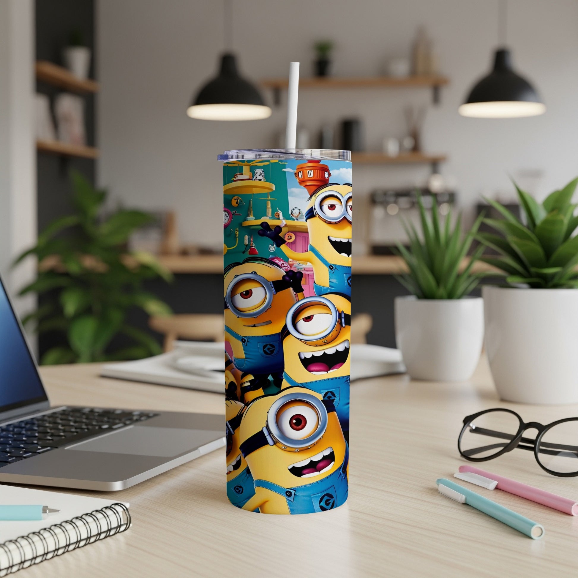 Minions characters on a tall, white travel tumbler with a straw.