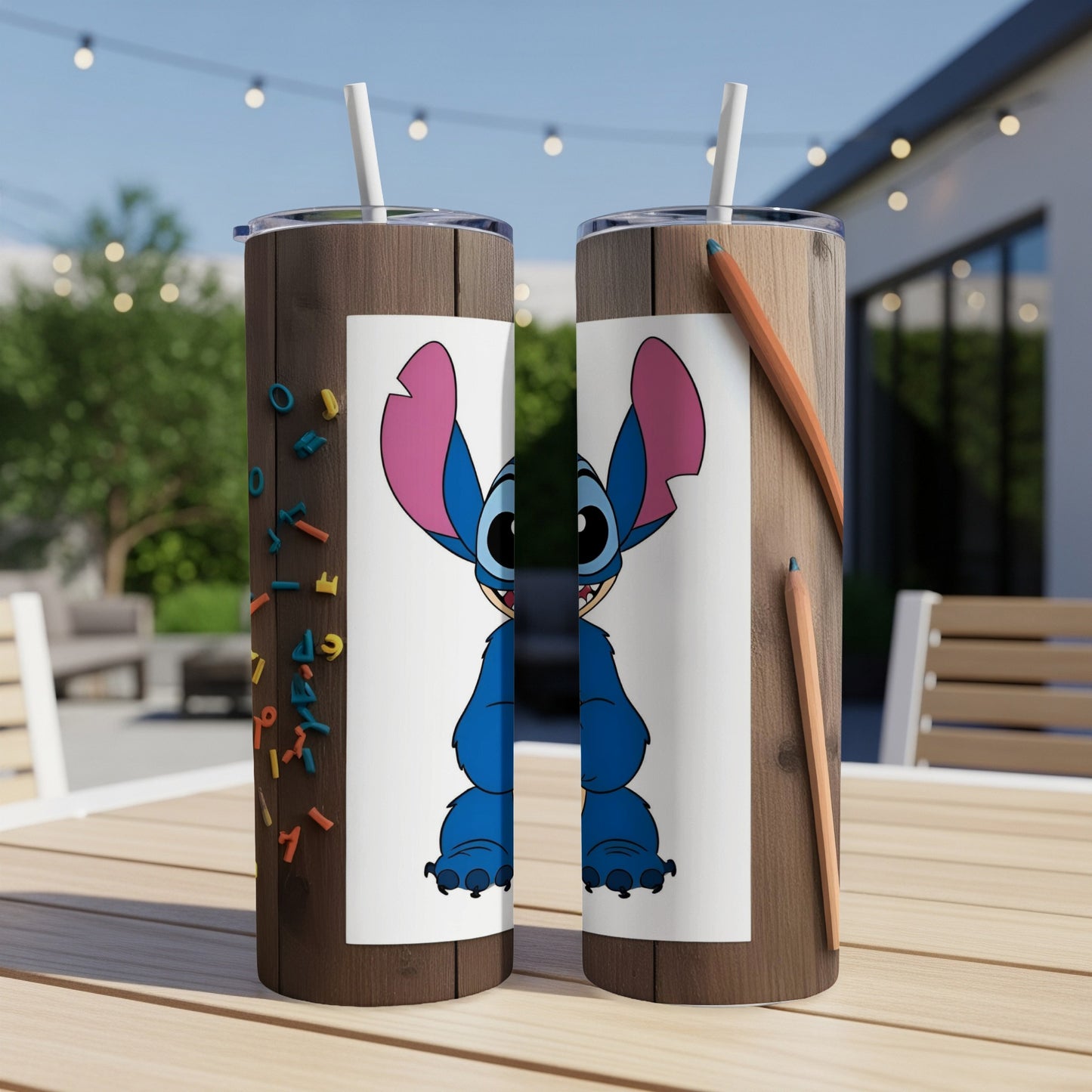 Two tumblers featuring Stitch from Lilo & Stitch against a wooden background with crayons.