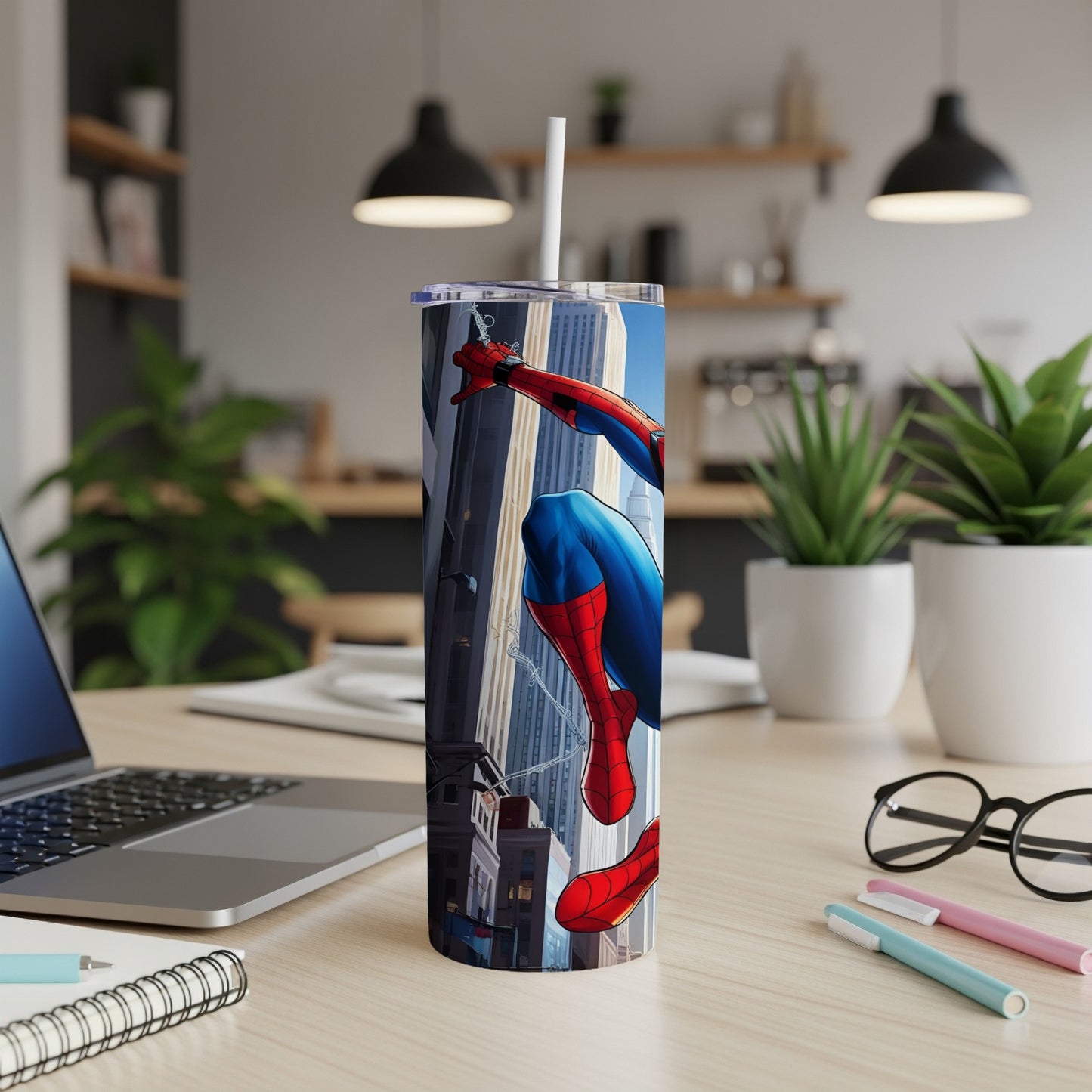 Spiderman in action on a cityscape tumbler with a straw.