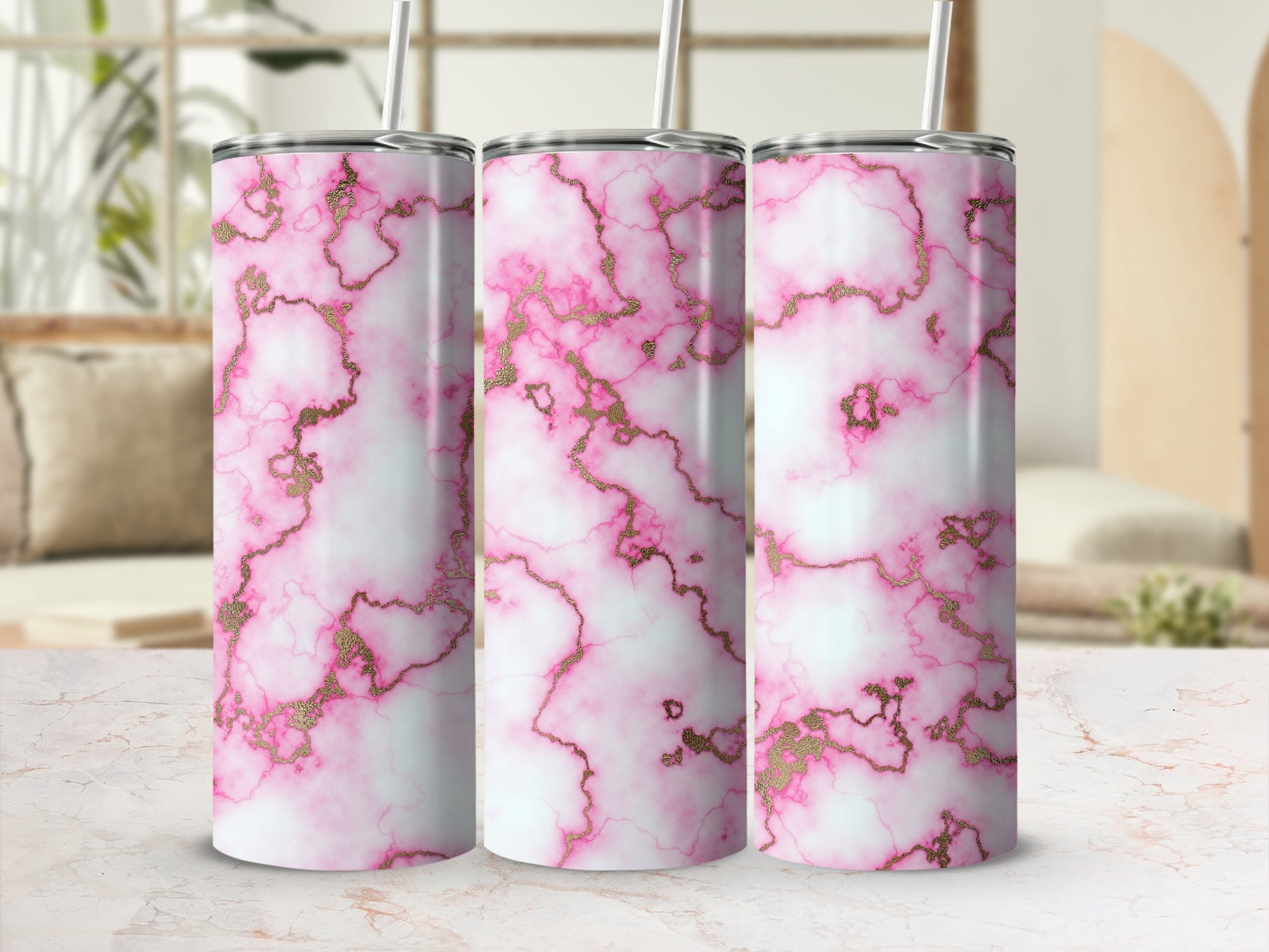 Pink and gold marble pattern tumbler with straw.