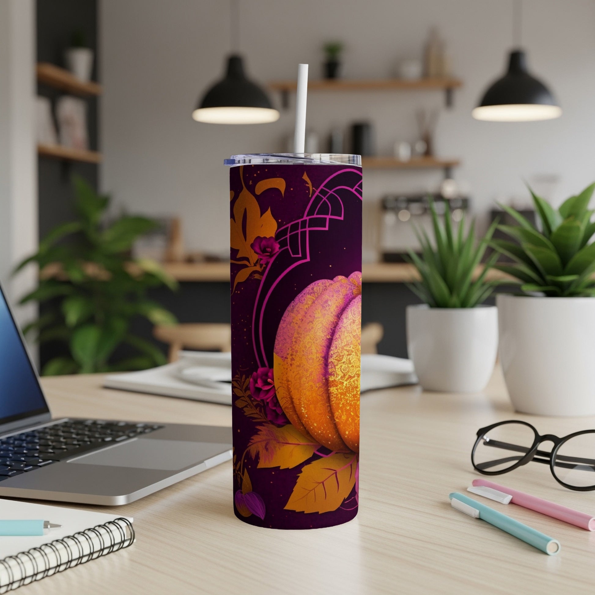 Purple tumbler with a sparkly pumpkin and floral design.