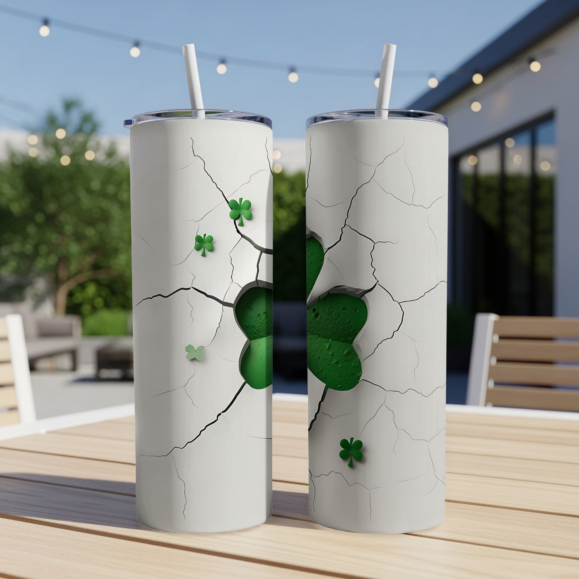 Two white tumblers with cracked design and green shamrocks.