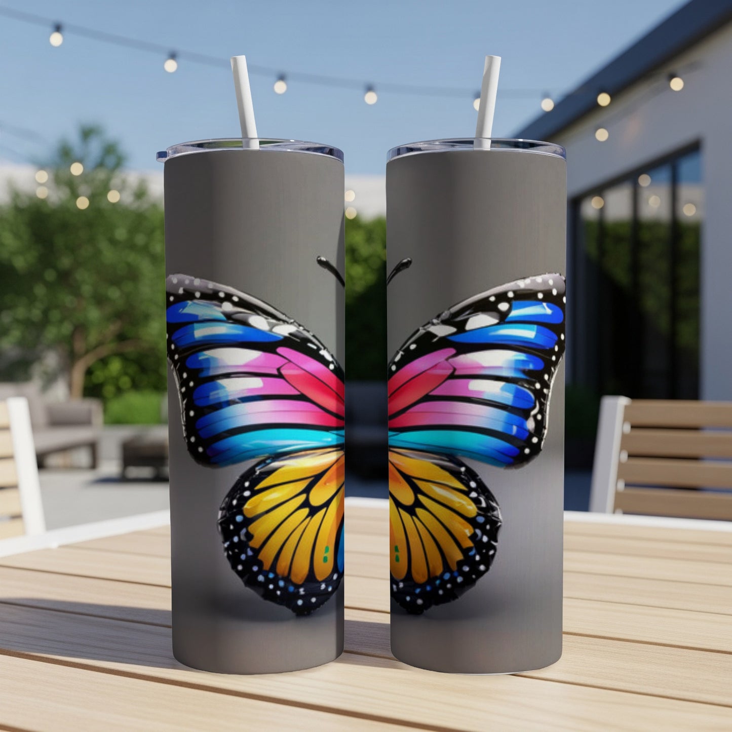 Two tumblers featuring a colorful split butterfly wing design.