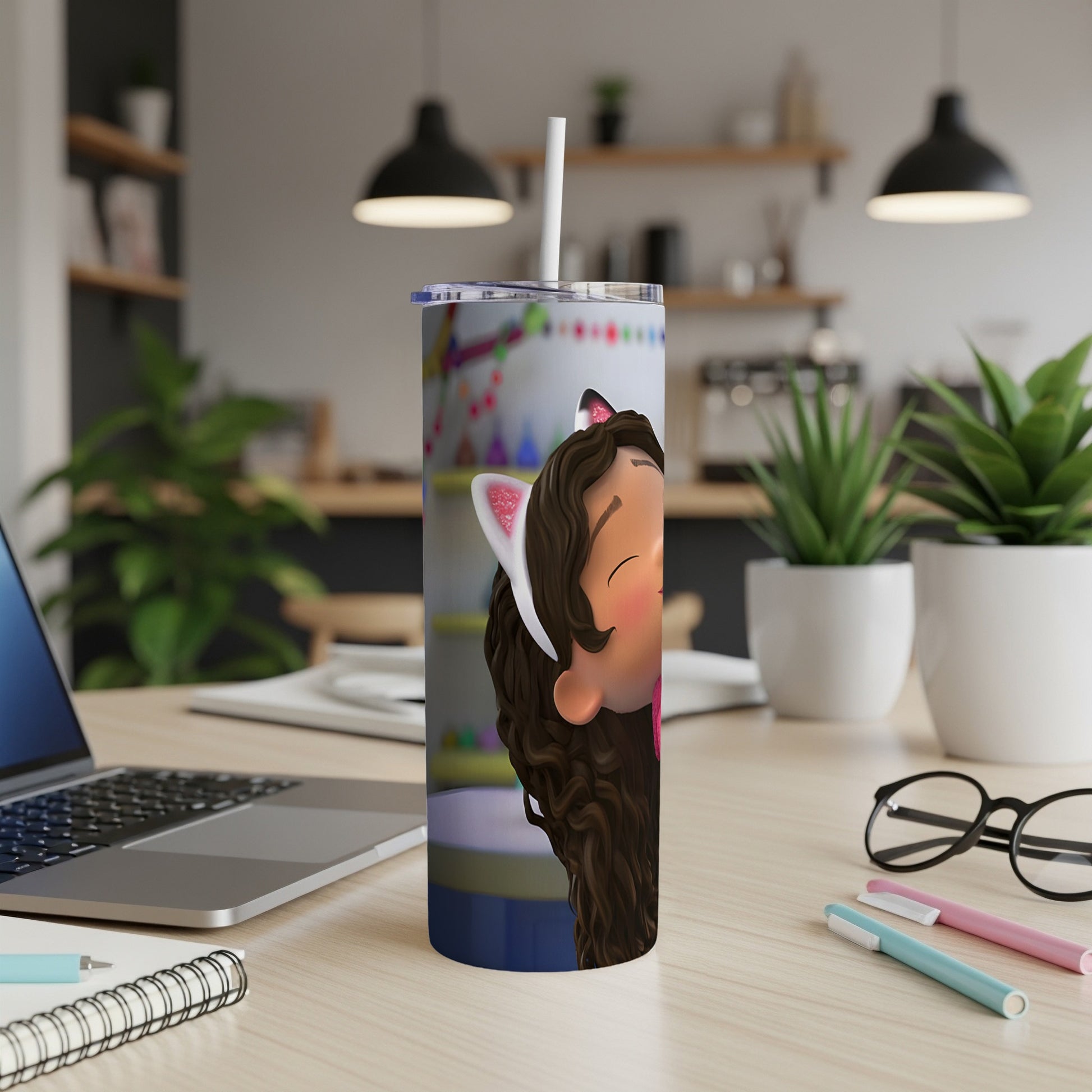 Gabby's Dollhouse tumbler with Gabby and Pandy Paws graphic on a desk.