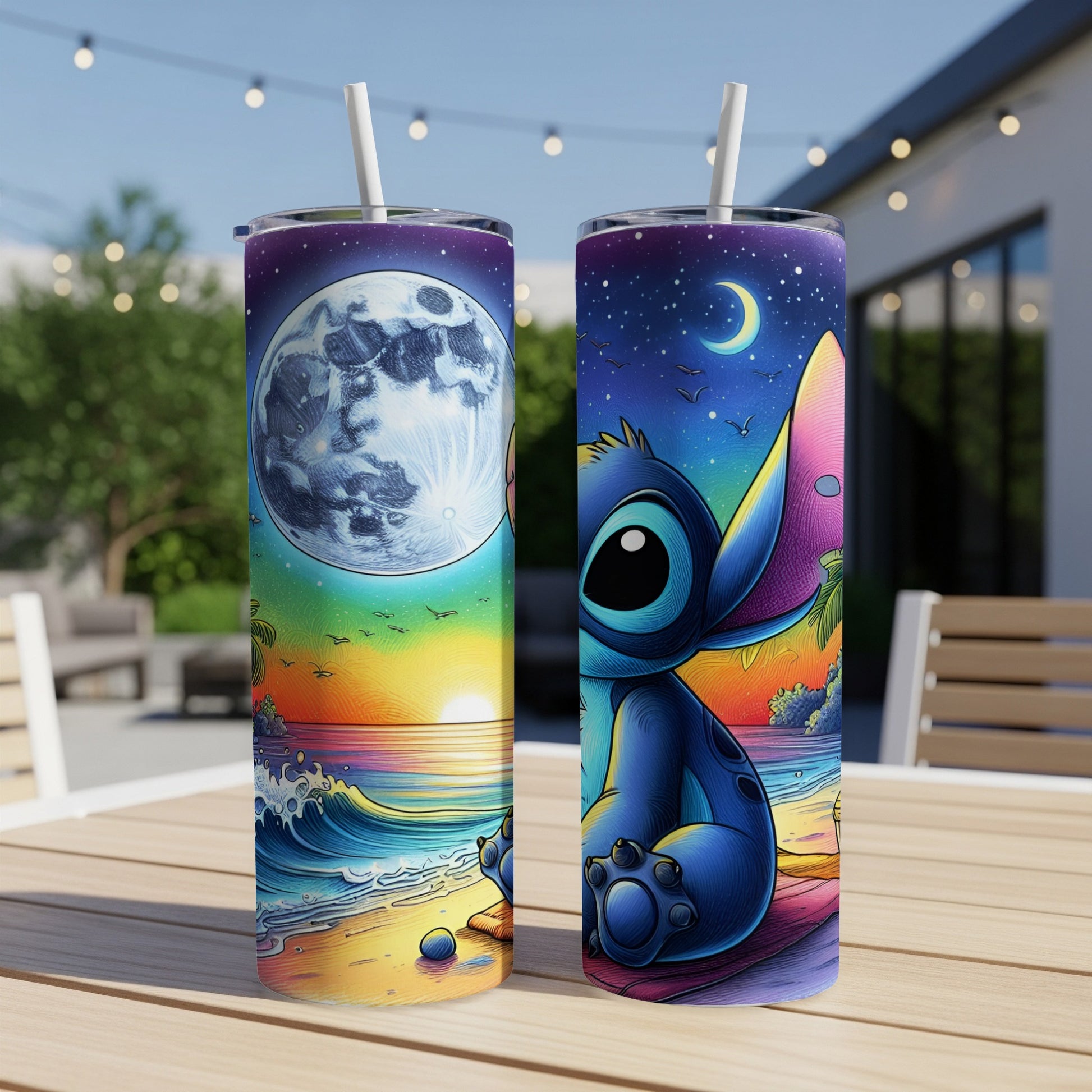 Stitch sitting on a beach with moon and stars on two tumblers.