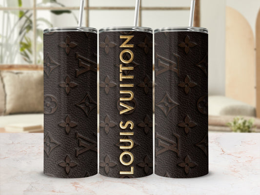 Dark brown tumbler with gold Louis Vuitton logo pattern and text.