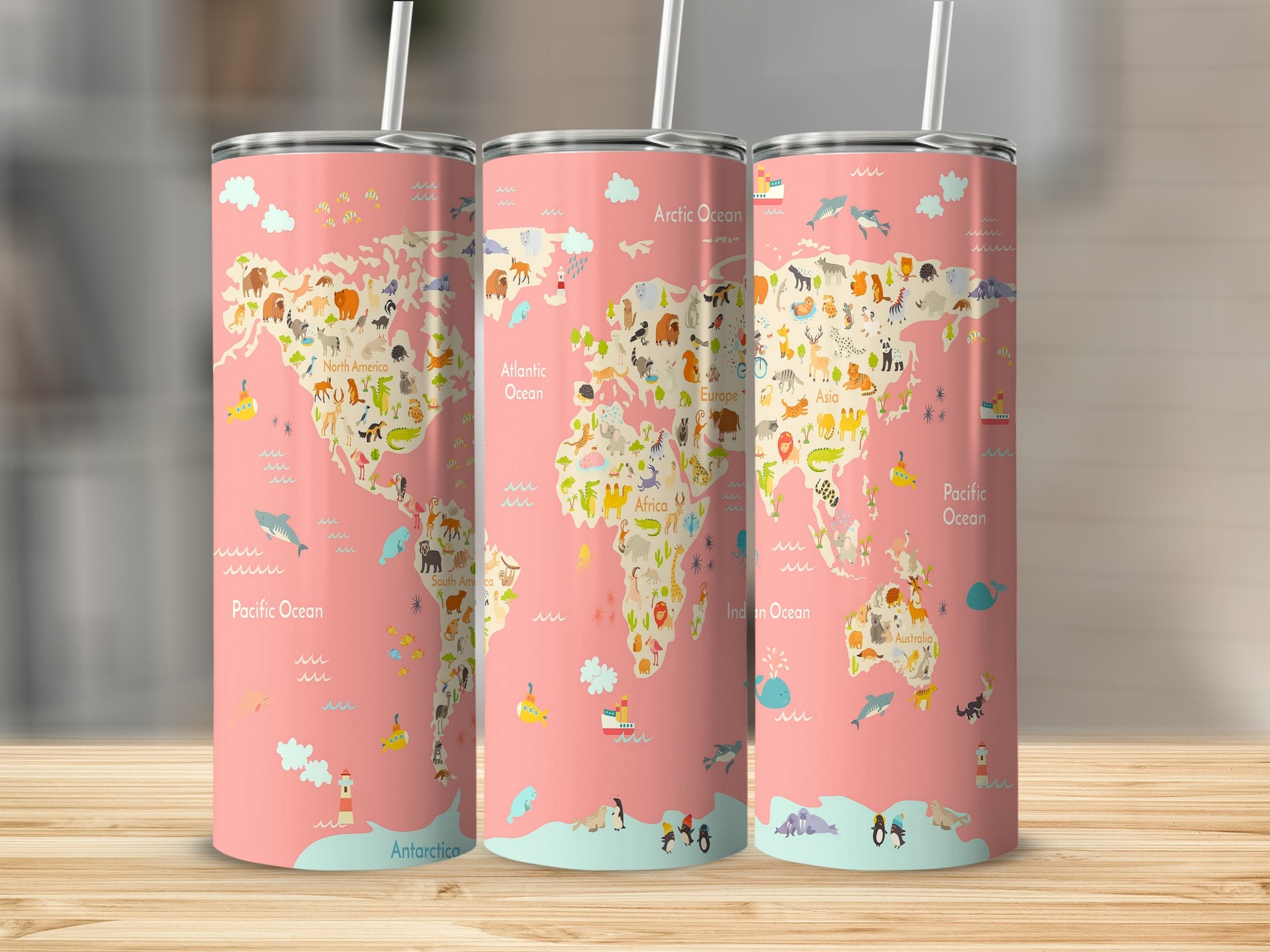 Pink tumblers with a world map design featuring cartoon animals and ocean labels.