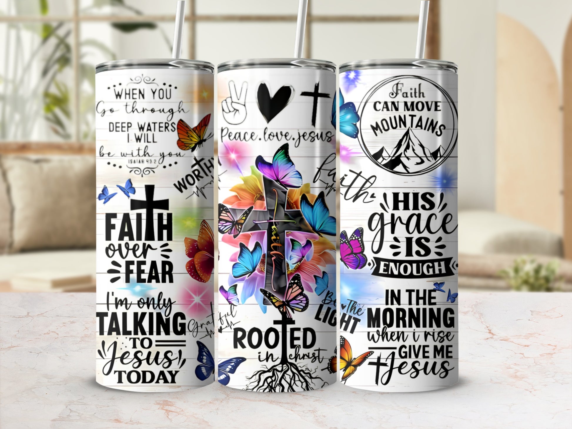 Faith over fear and mountains moving with Jesus text on tumblers.