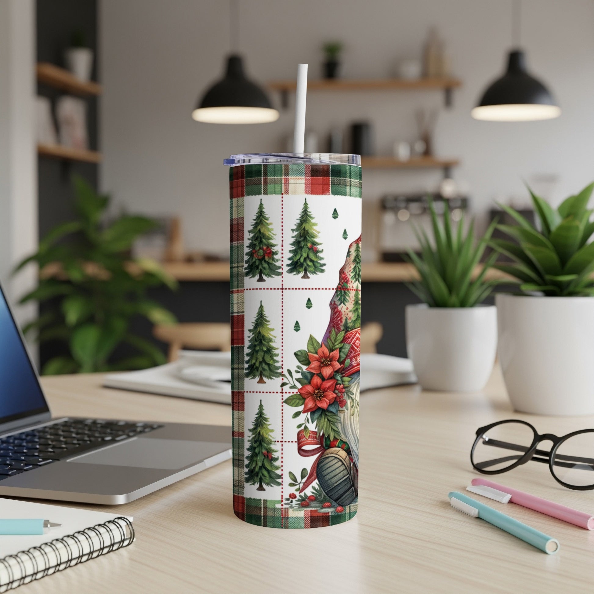 Christmas gnome on plaid tumbler with trees, flowers, and straw.