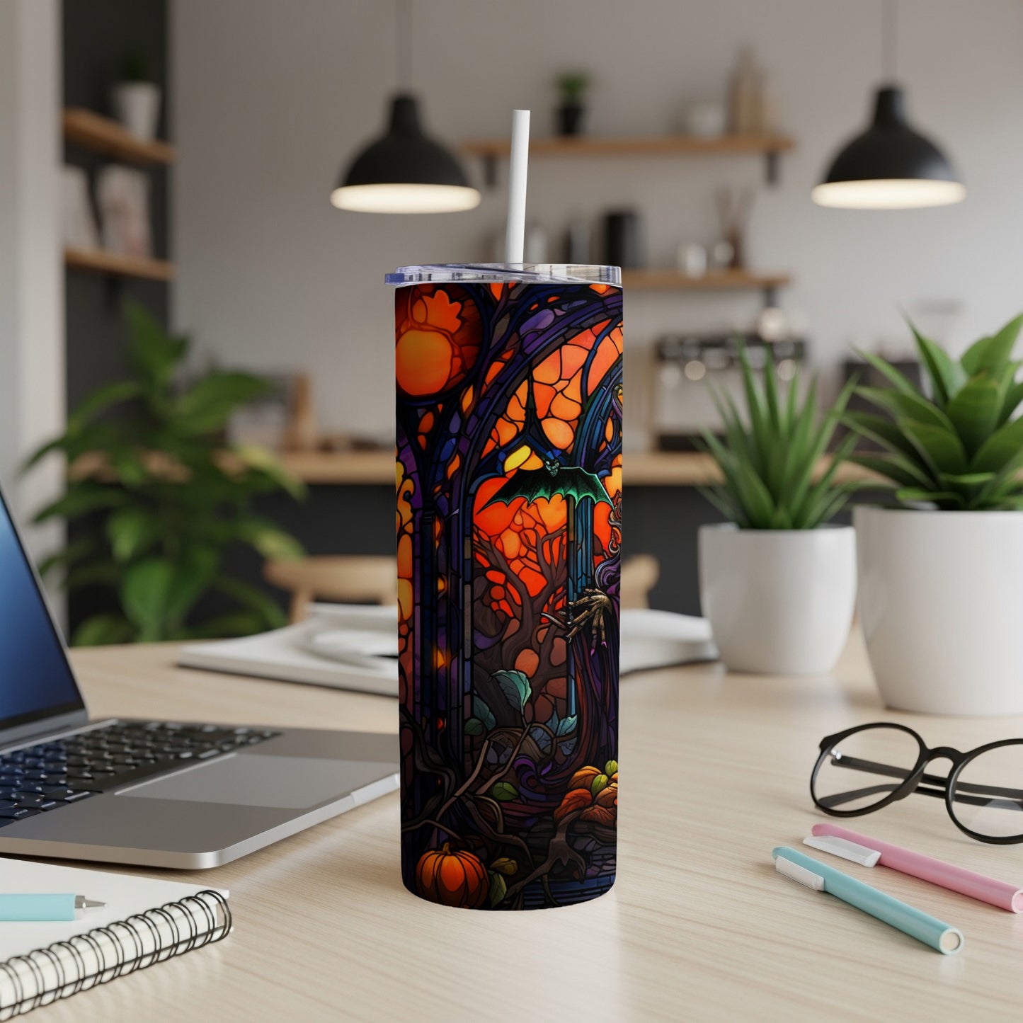 Stained glass tumbler with Halloween scene featuring bats and pumpkins.