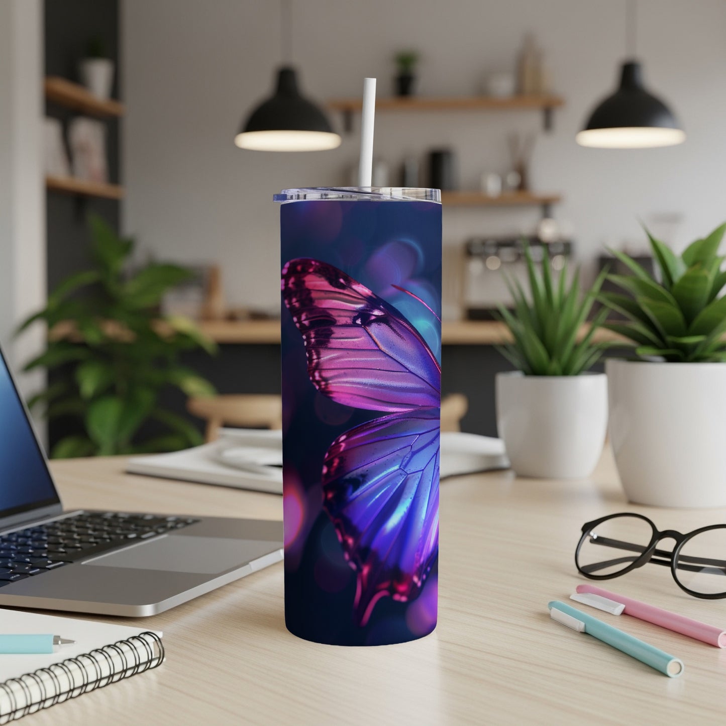 Tumbler with a close-up of a butterfly wing in shades of pink and blue.