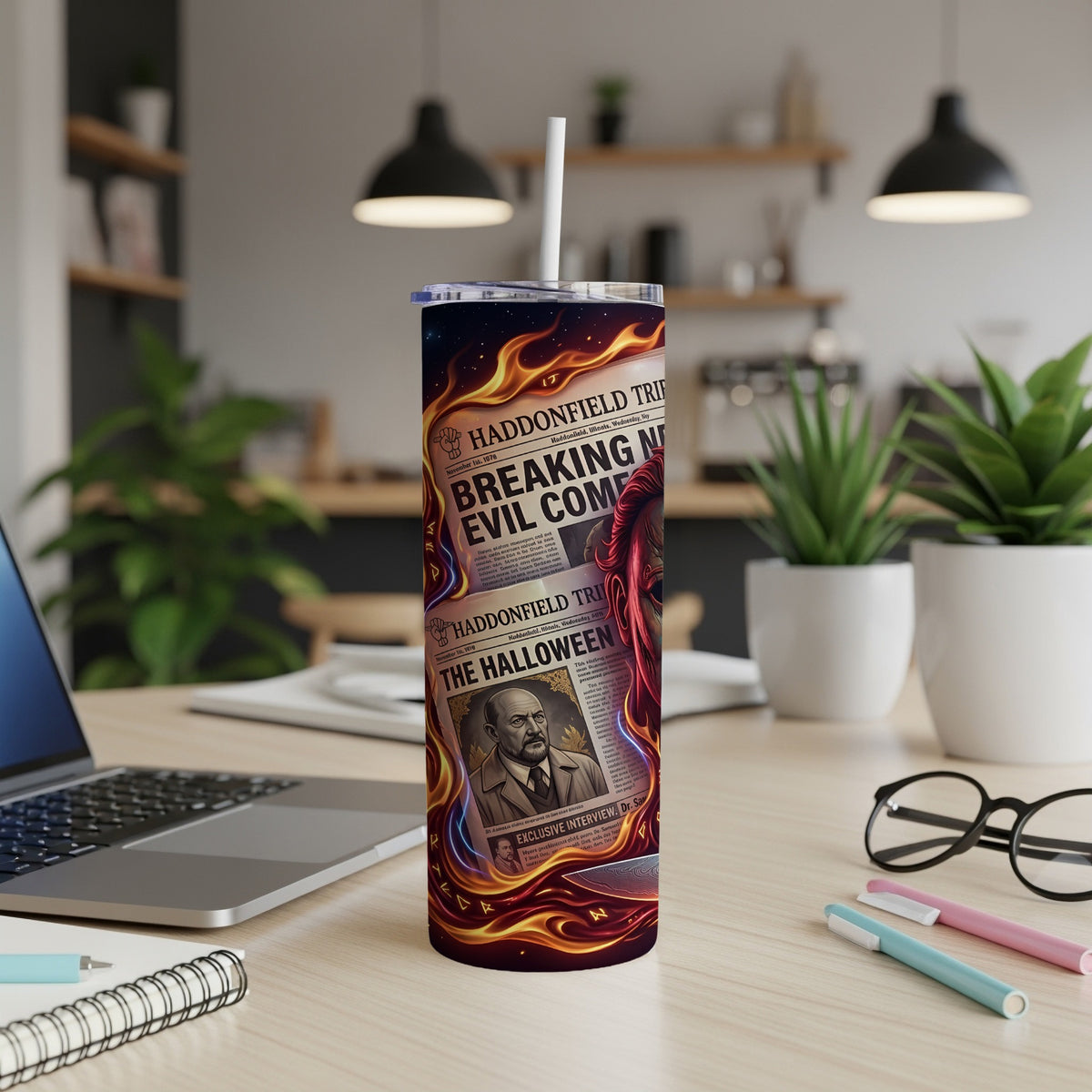 Tumbler with newspaper headlines "Breaking Evil Come" and "The Halloween" and flame graphics.