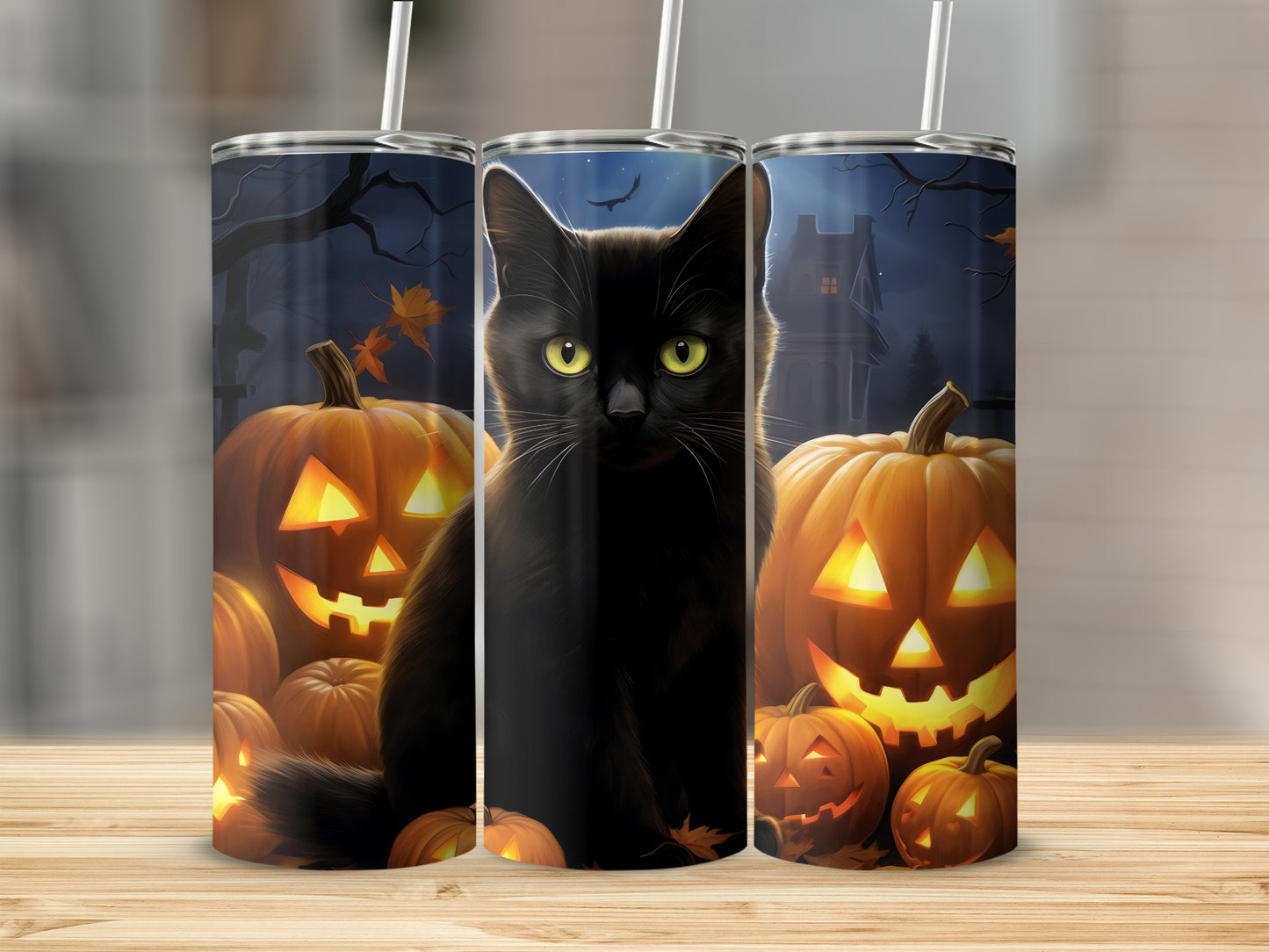 Black cat and pumpkins on a Halloween themed tumbler.