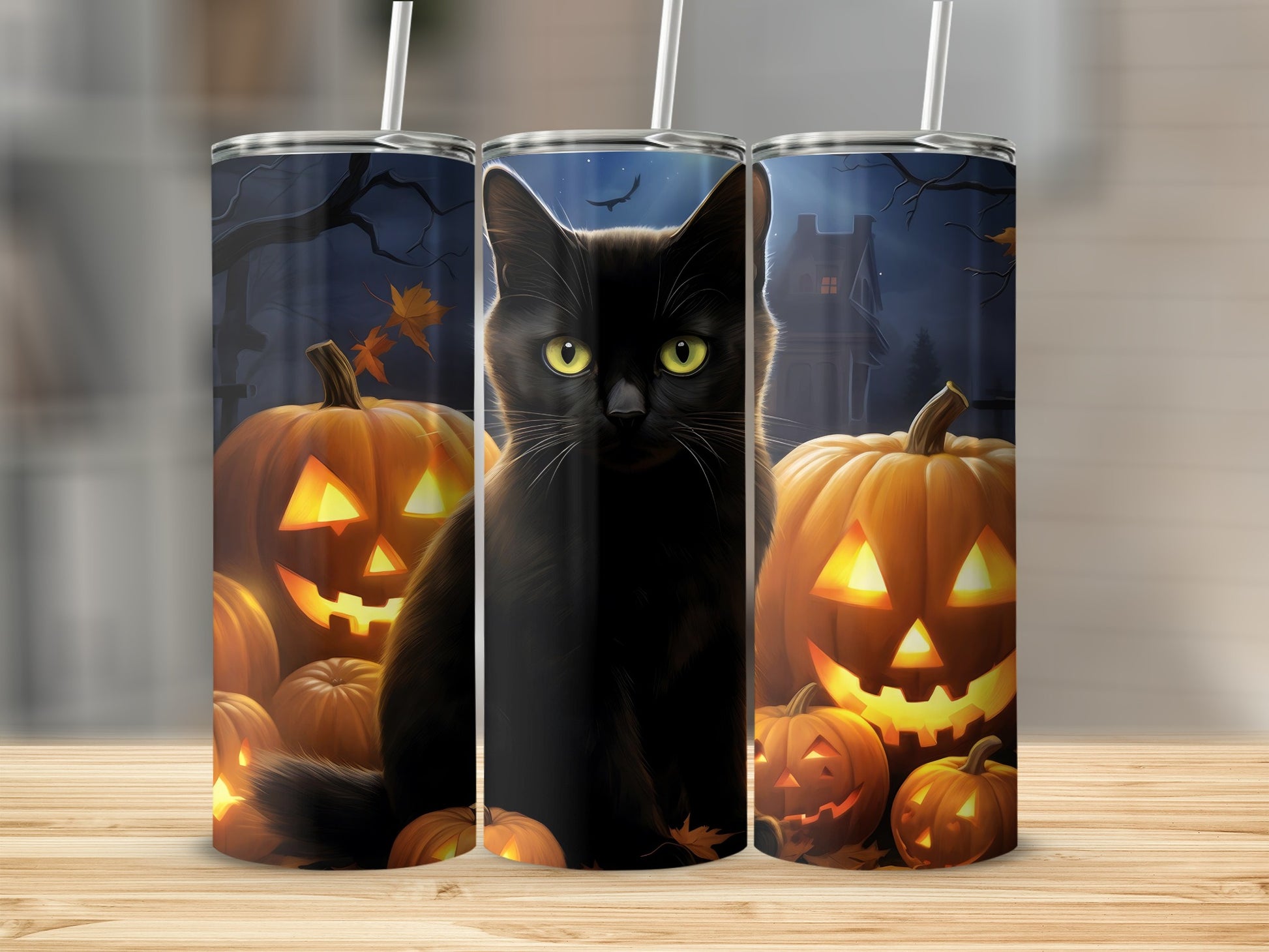 Black cat and pumpkins on a Halloween themed tumbler.