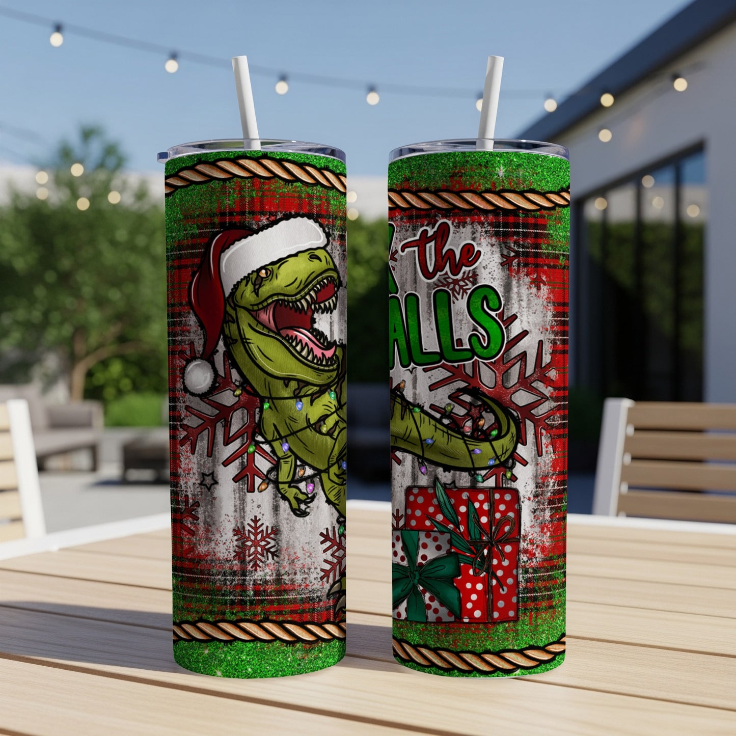 Christmas T-Rex with Santa hat, snowflakes, and presents on a tumbler.