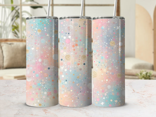 Pastel confetti pattern on three tall, slim tumblers with straws.