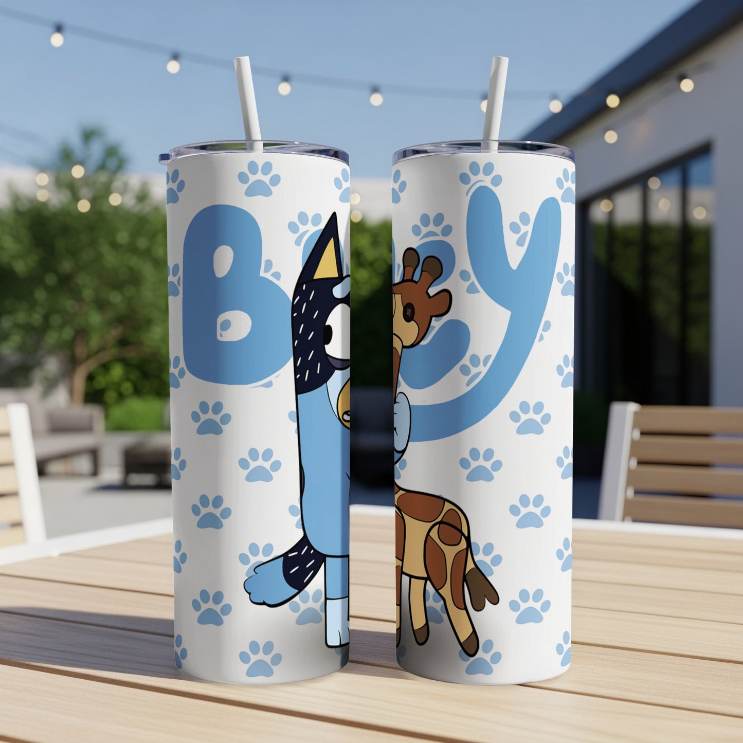 Bluey and Bingo characters on a blue tumbler with paw print pattern.