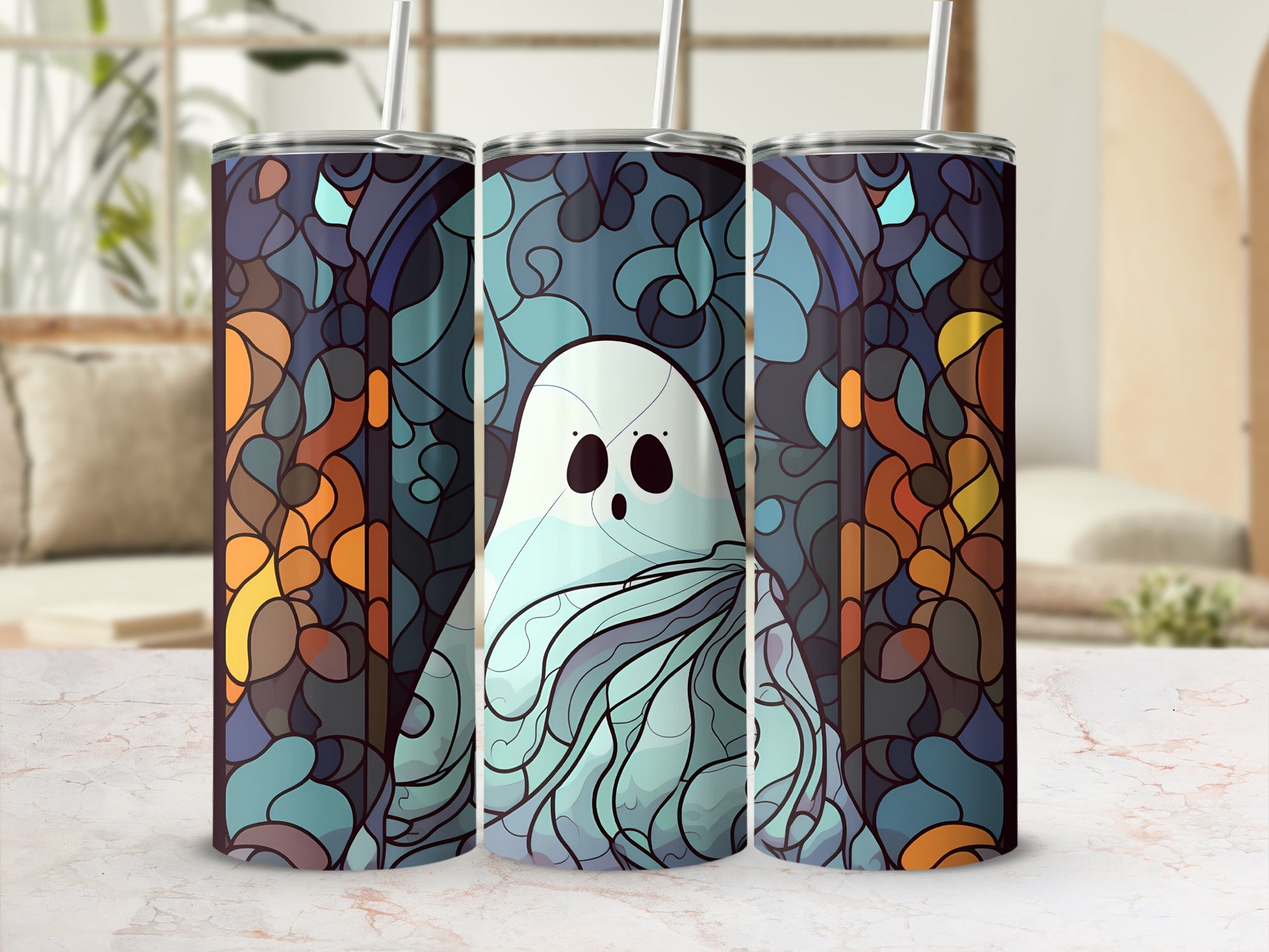 Three tumblers with a blue and orange stained-glass ghost design.