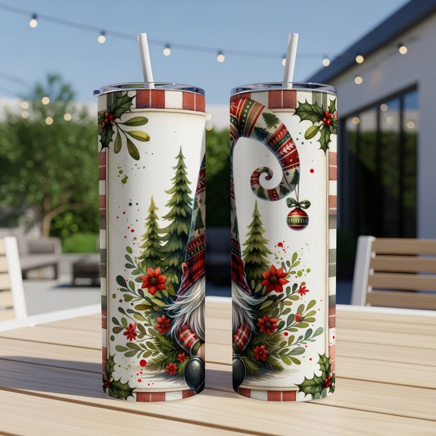 Two Christmas gnomes on tumblers with festive greenery and ornaments.