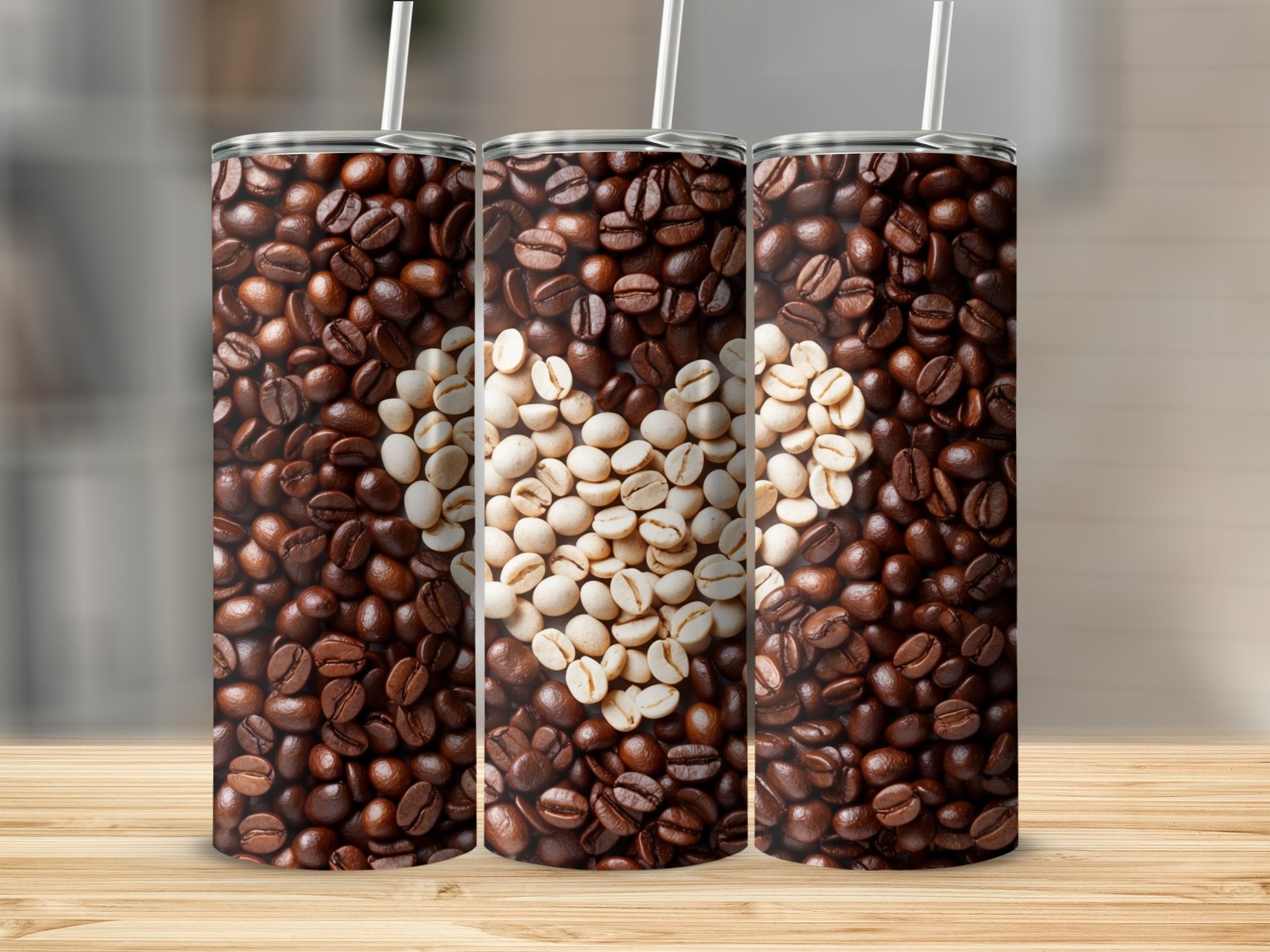 Three tumblers with coffee bean heart design on wooden surface.