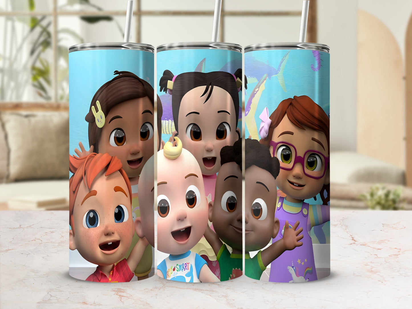 Cocomelon characters on a cylindrical tumbler with straws.