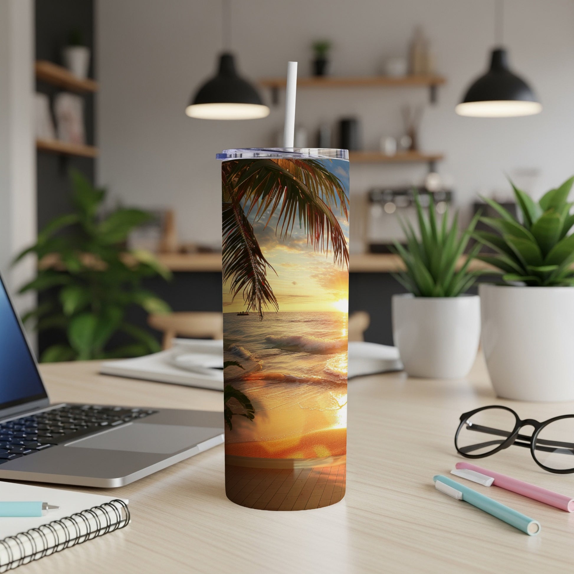 Tumbler with tropical sunset beach scene and palm leaves.