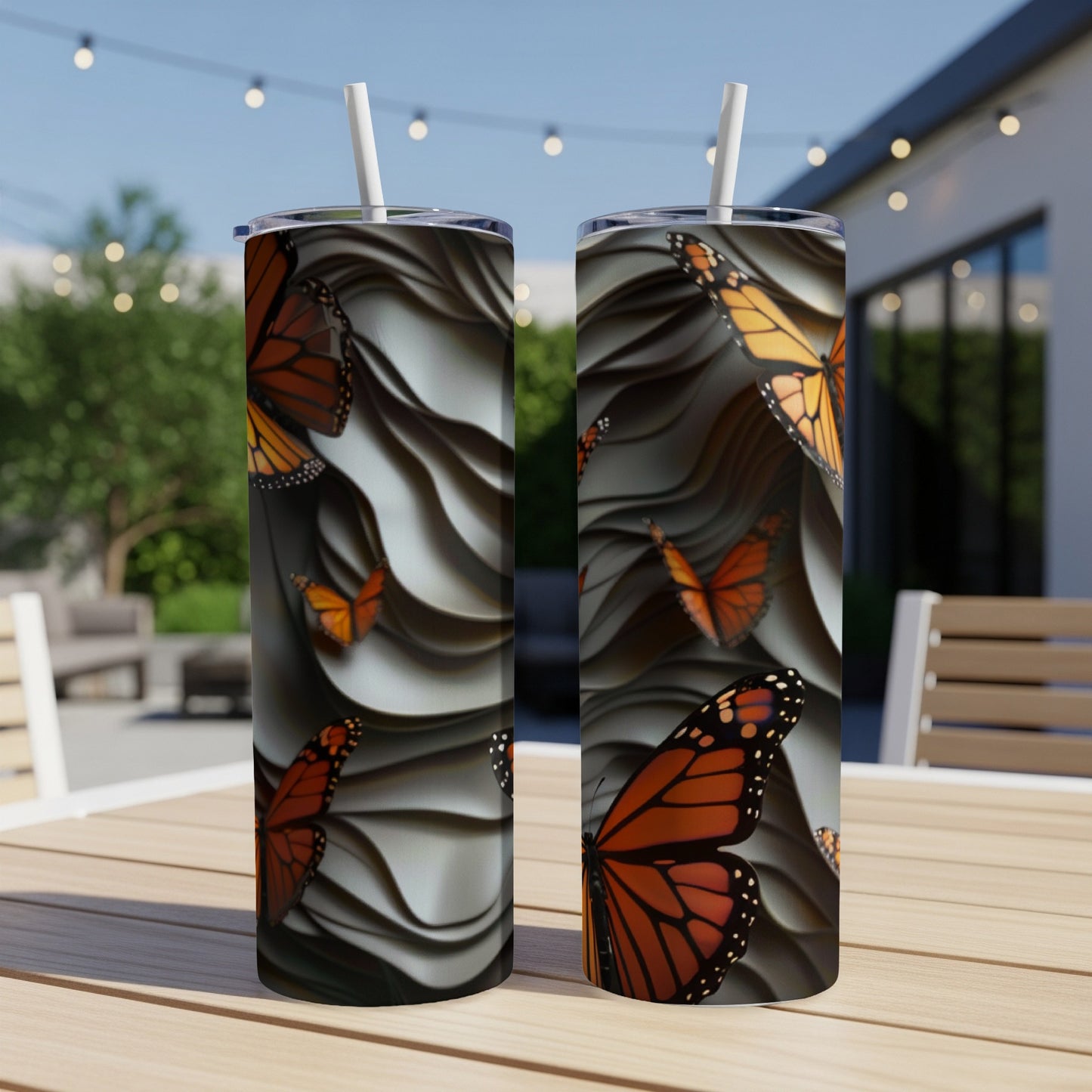 Two monarch butterflies on a textured thermos with a straw.